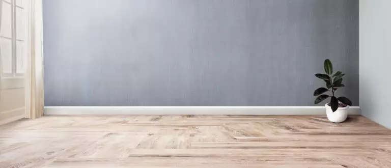 What color of the floor matches gray walls