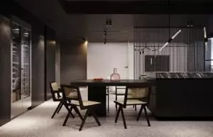 Nature-inspired dining chairs in an all-black functional kitchen