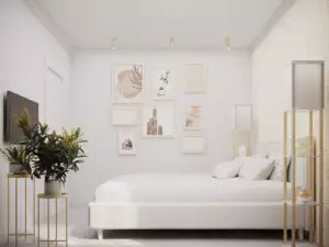 Aesthetic gallery wall in a white and gold bedroom