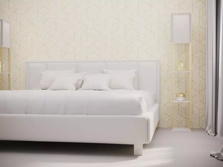 Designer mark in a contemporary bedroom: all-white bed