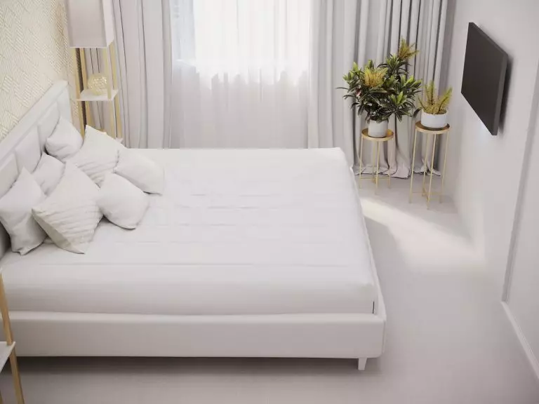 Ergonomic layout in a small all-white bedroom