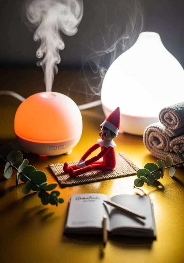 Elf on the Shelf sitting on a small mat with legs outstretched, next to two glowing essential oil diffusers, rolled towels, eucalyptus leaves, and an open journal.