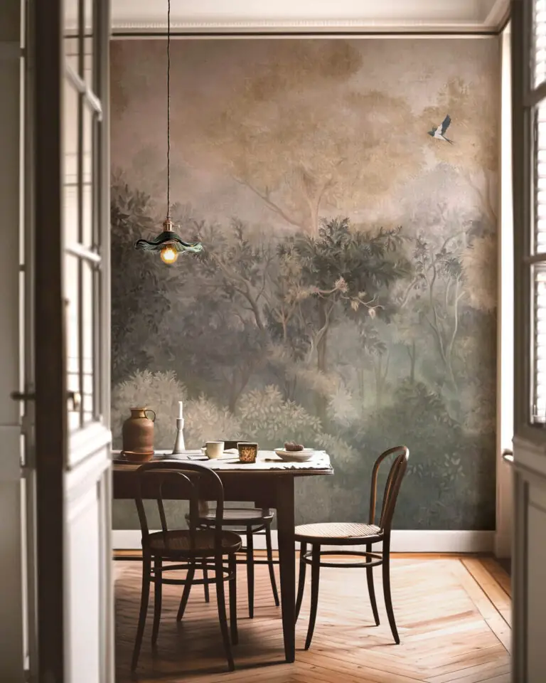 An elegant dining room showcasing a painterly forest mural, a dark wooden table, and traditional chairs viewed through French doors.