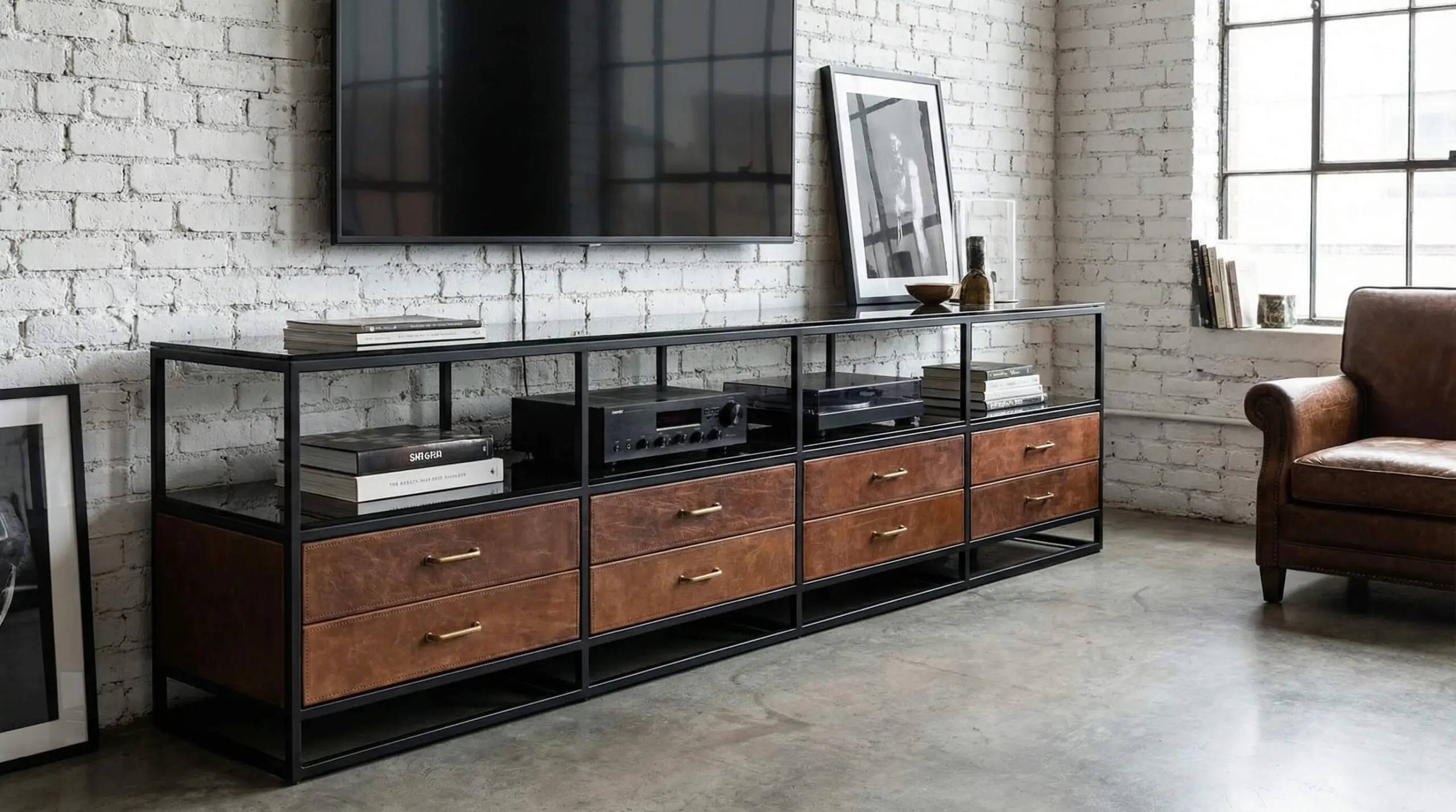 Industrial luxury entertainment unit with a matte black metal frame, smoked glass shelves, and distressed leather drawers.