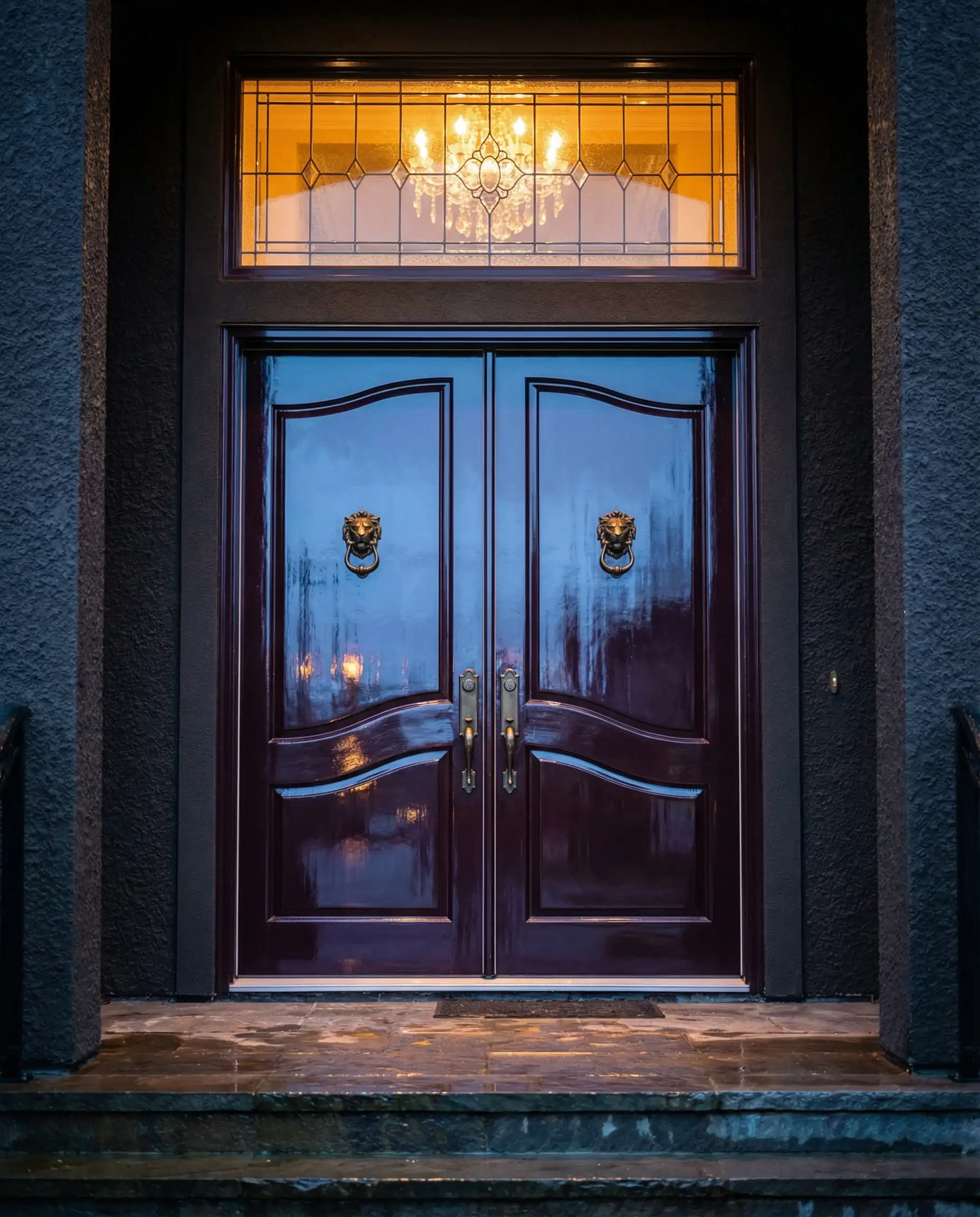 High-gloss deep aubergine purple front door with antique brass lion head knocker.