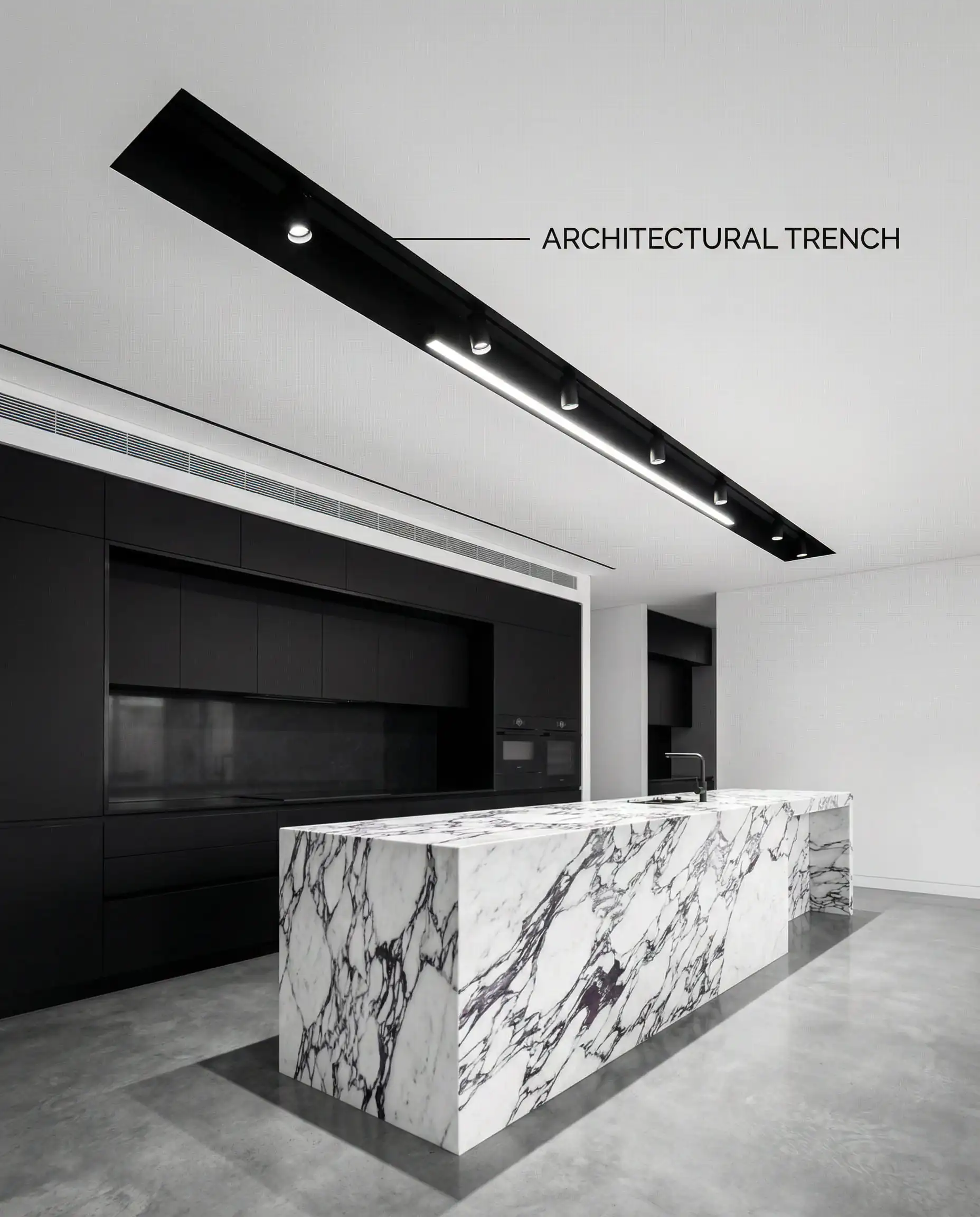 Plafond de cuisine blanc moderne avec une rigole encastrée noire abritant des spots sur rail magnétique au-dessus de l'îlot.