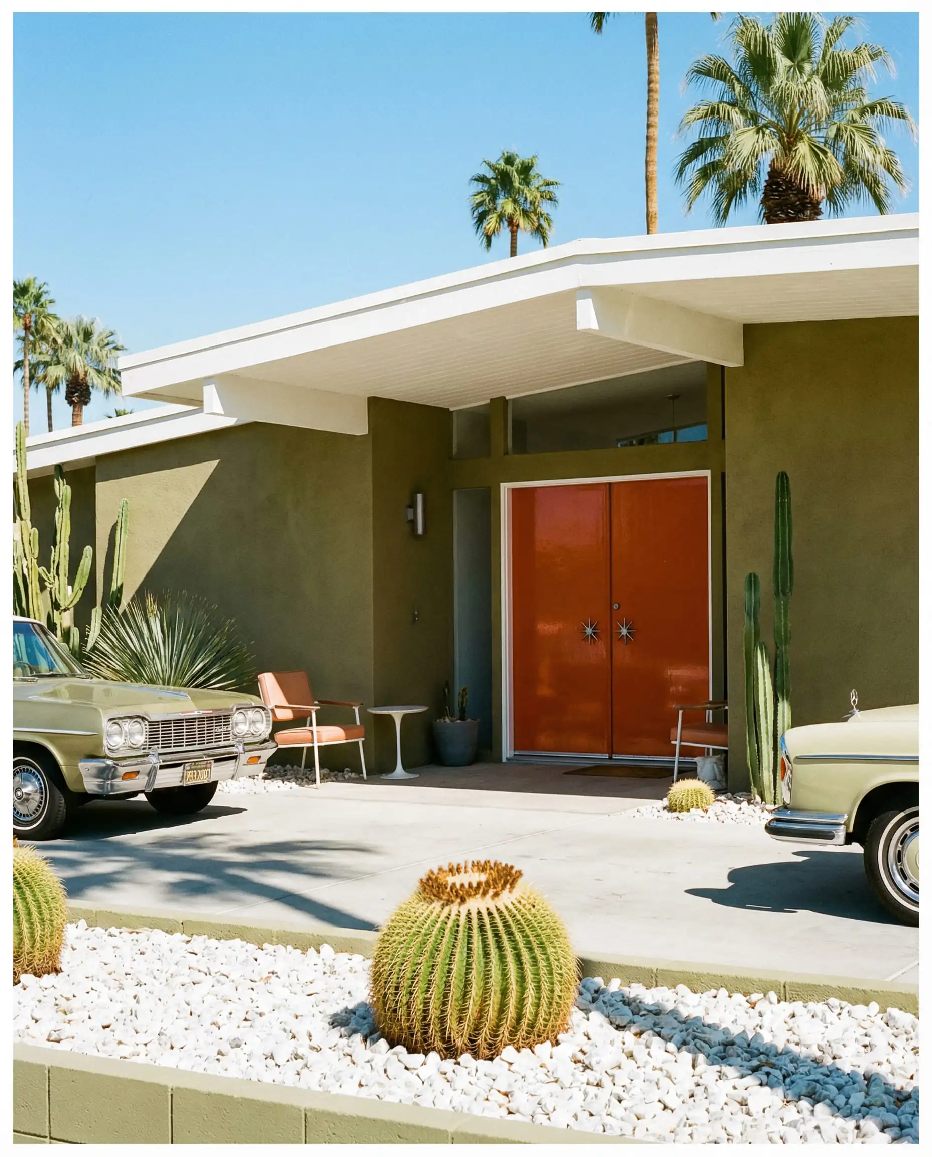 Olive green mid-century home in Palm Springs featuring a vibrant burnt orange front door.