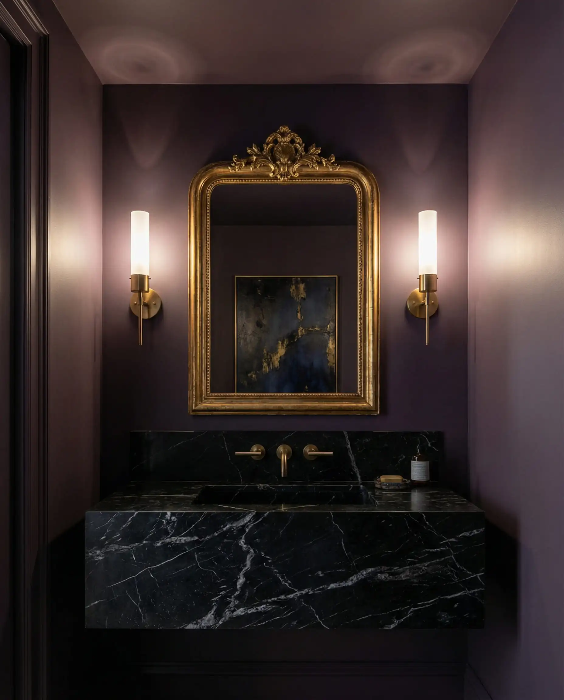 Luxurious powder room with walls painted in deep eggplant Behr Curtain Call and marble vanity.