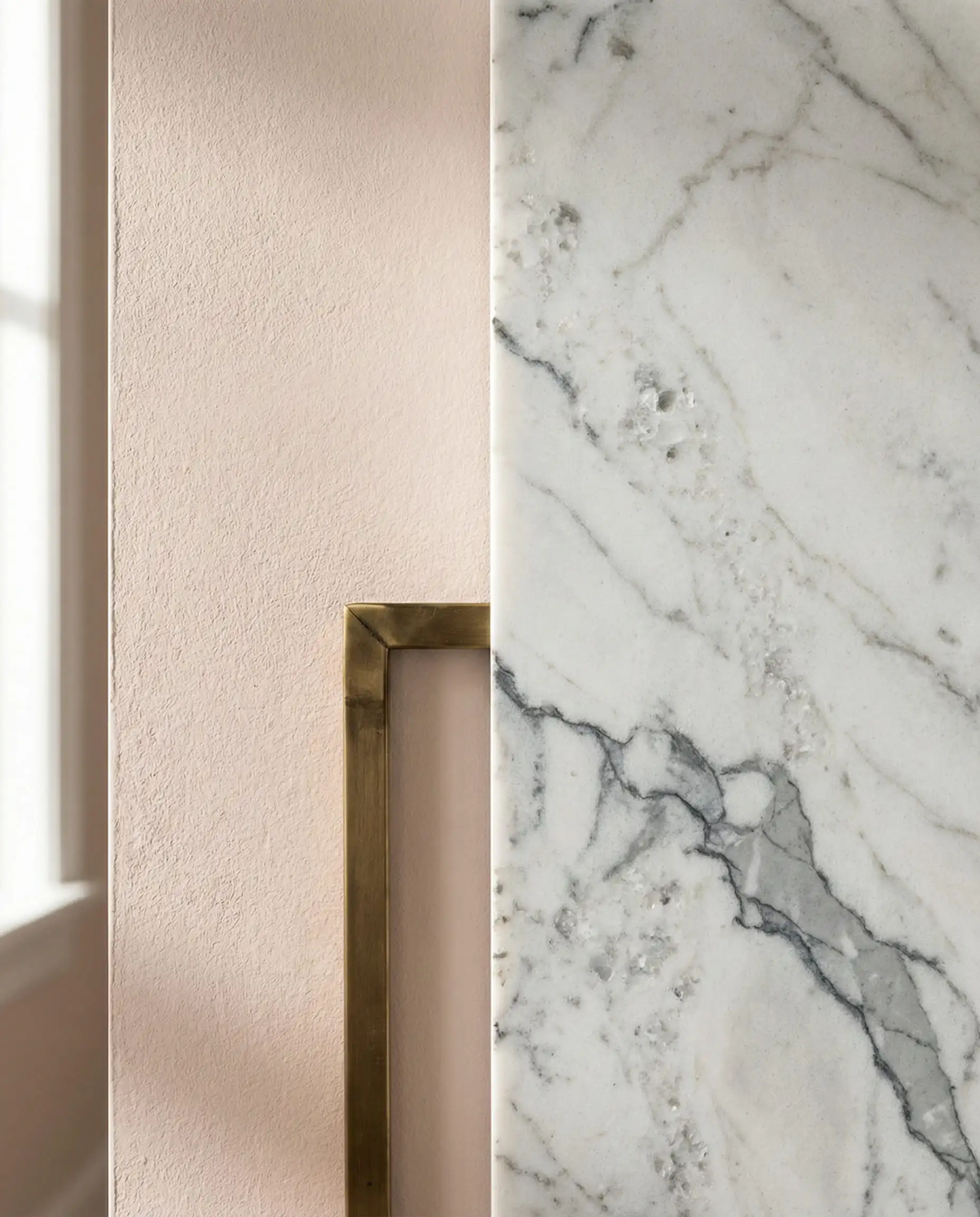 Macro shot of Benjamin Moore First Crush paint texture next to gray-veined Carrara marble.