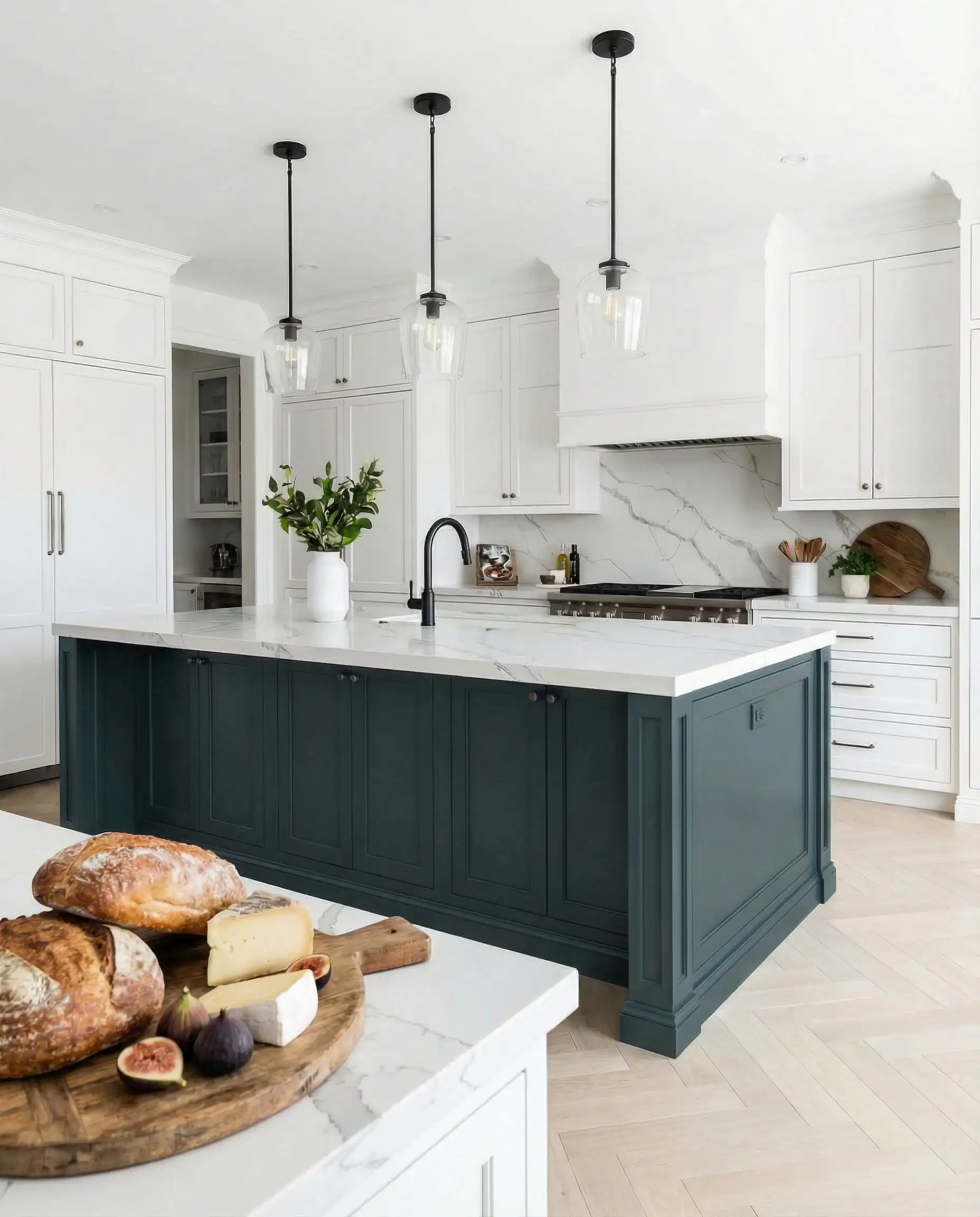 Kitchen island painted in deep Benjamin Moore Narragansett Green HC-157 with marble countertops.