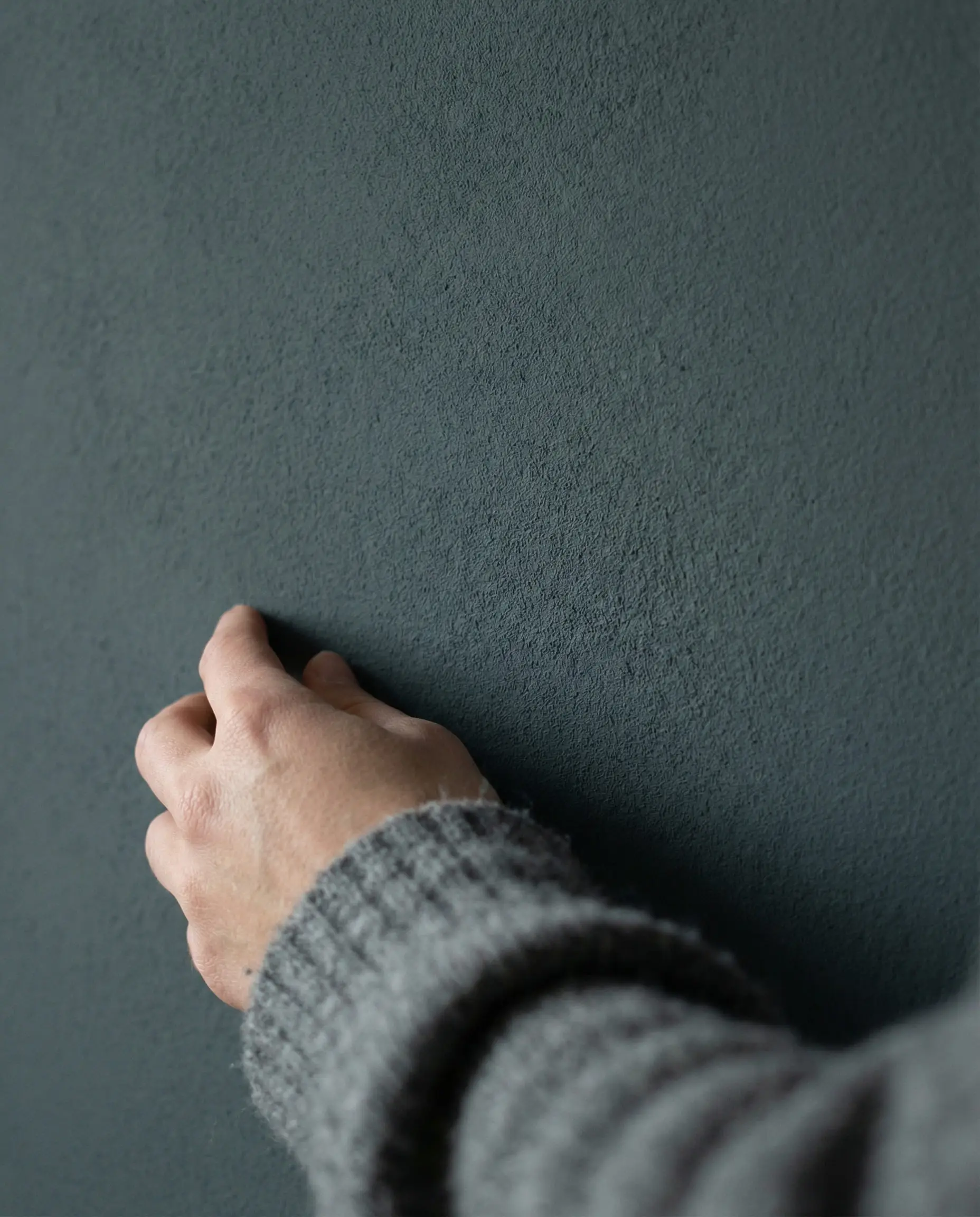 Close up texture shot of flat matte dark paint showing no reflection and velvety finish.