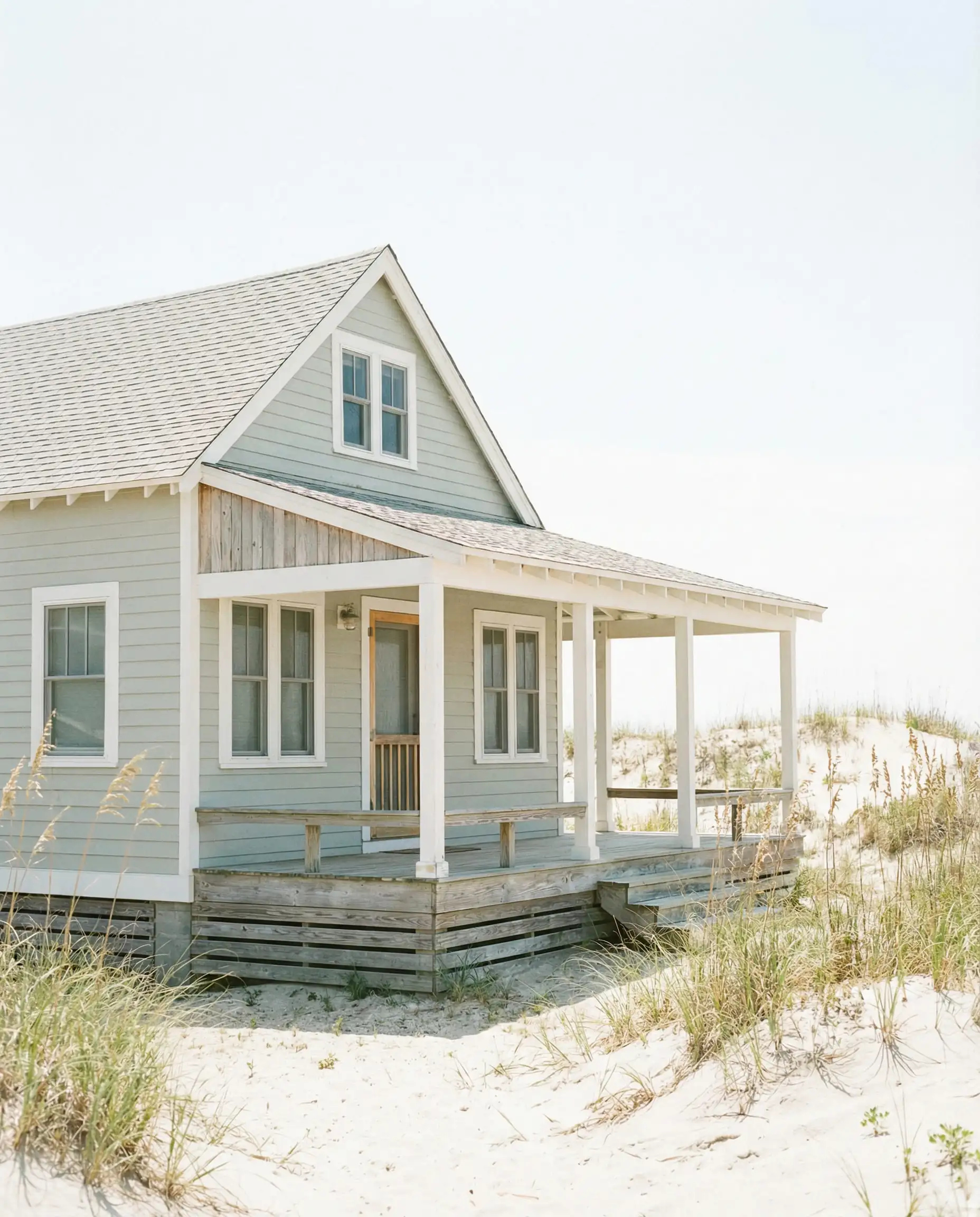 Breezy beach cottage painted in Sherwin-Williams Silver Strand (SW 7057).