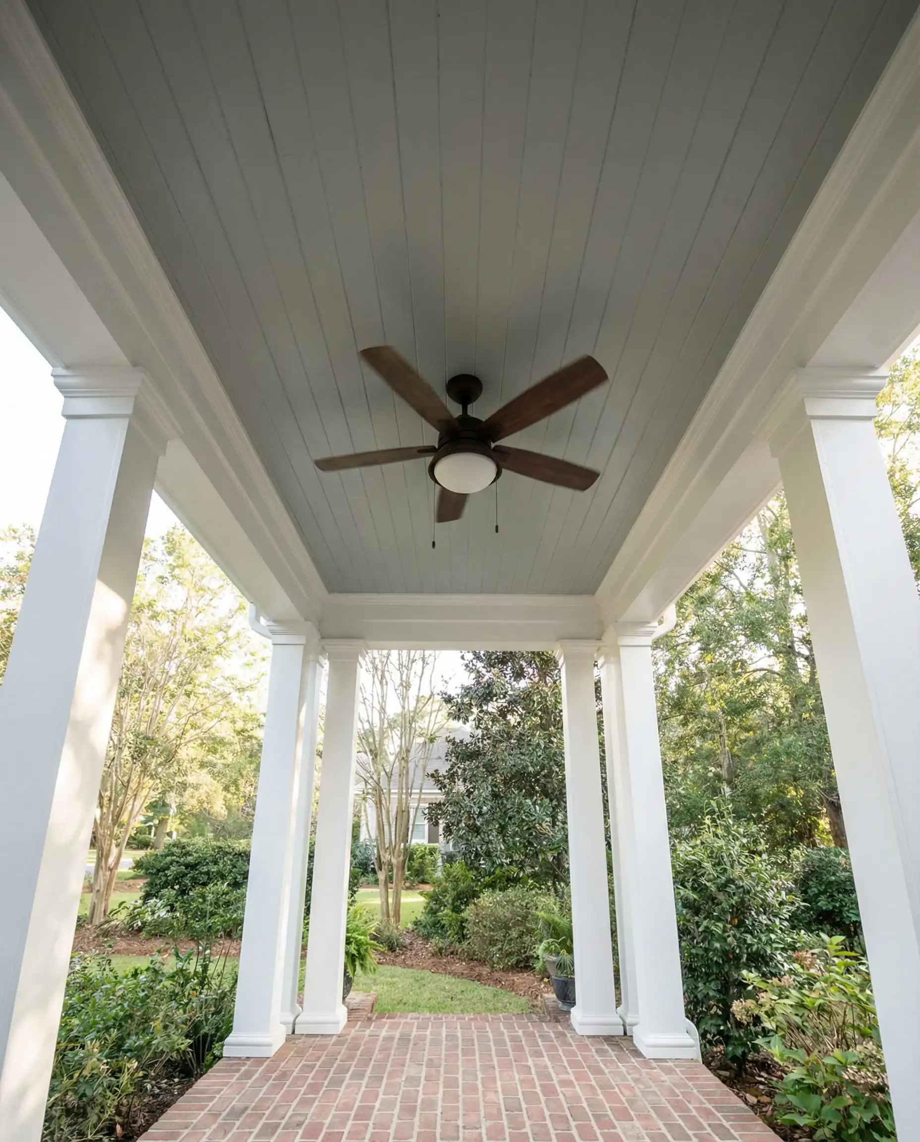 Porch ceiling painted in Sherwin-Williams Silver Strand as a modern Haint Blue.