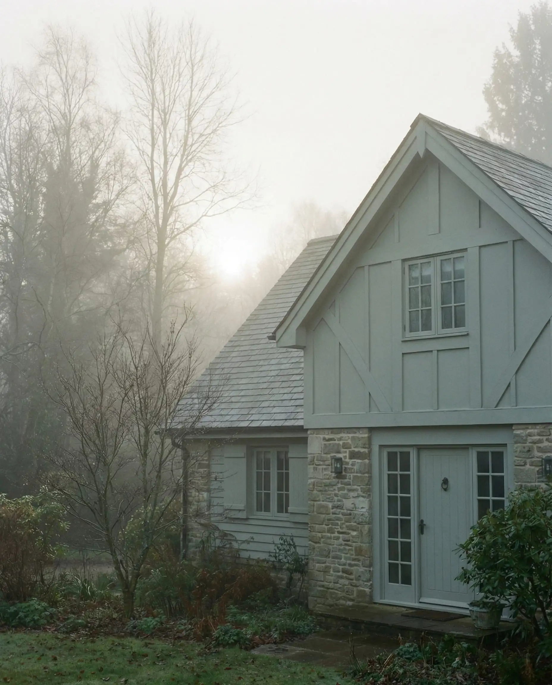 Exterior home in morning mist painted in Sherwin-Williams Silver Strand.