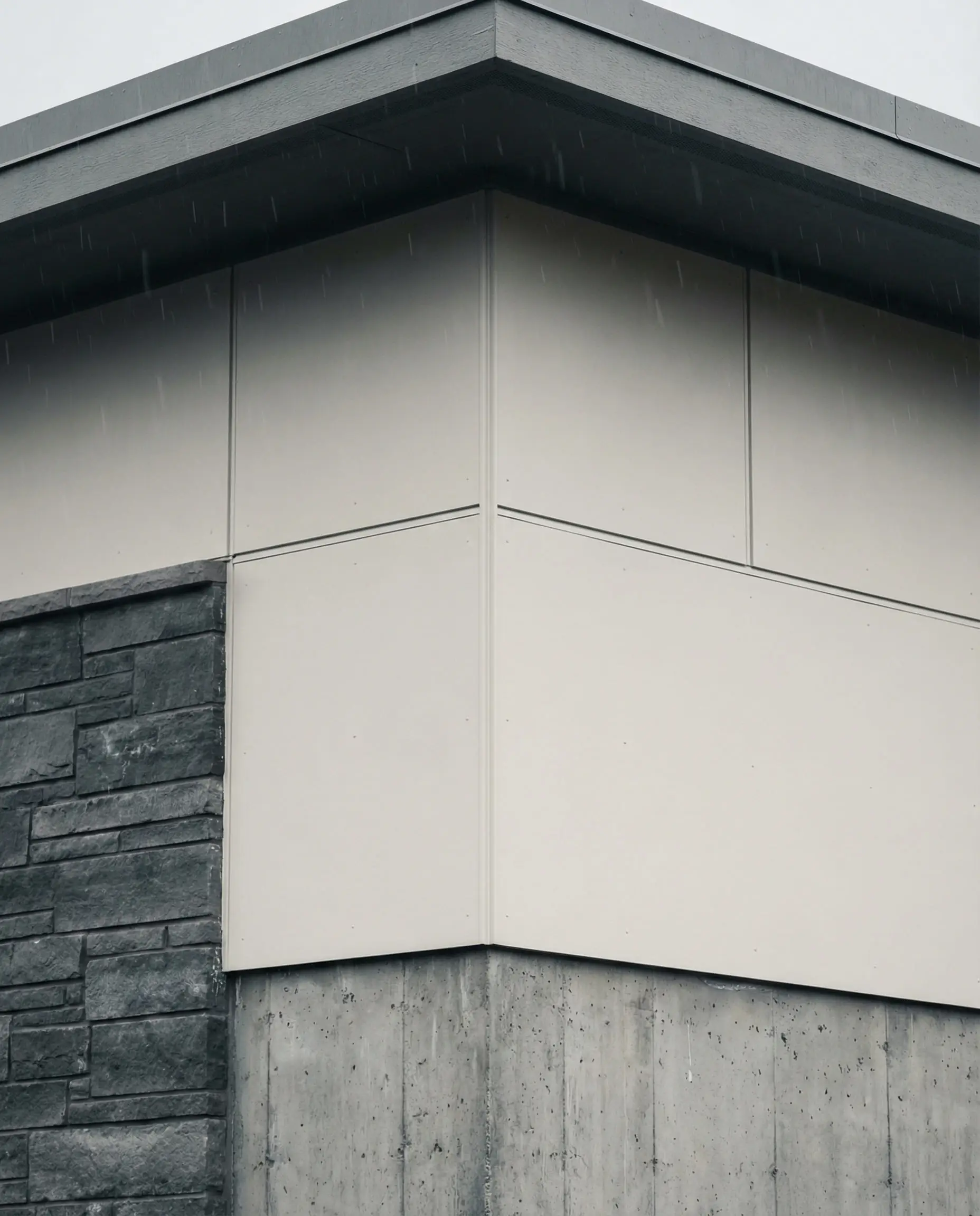 Sherwin-Williams Snowbound siding paired with cool gray stone veneer.