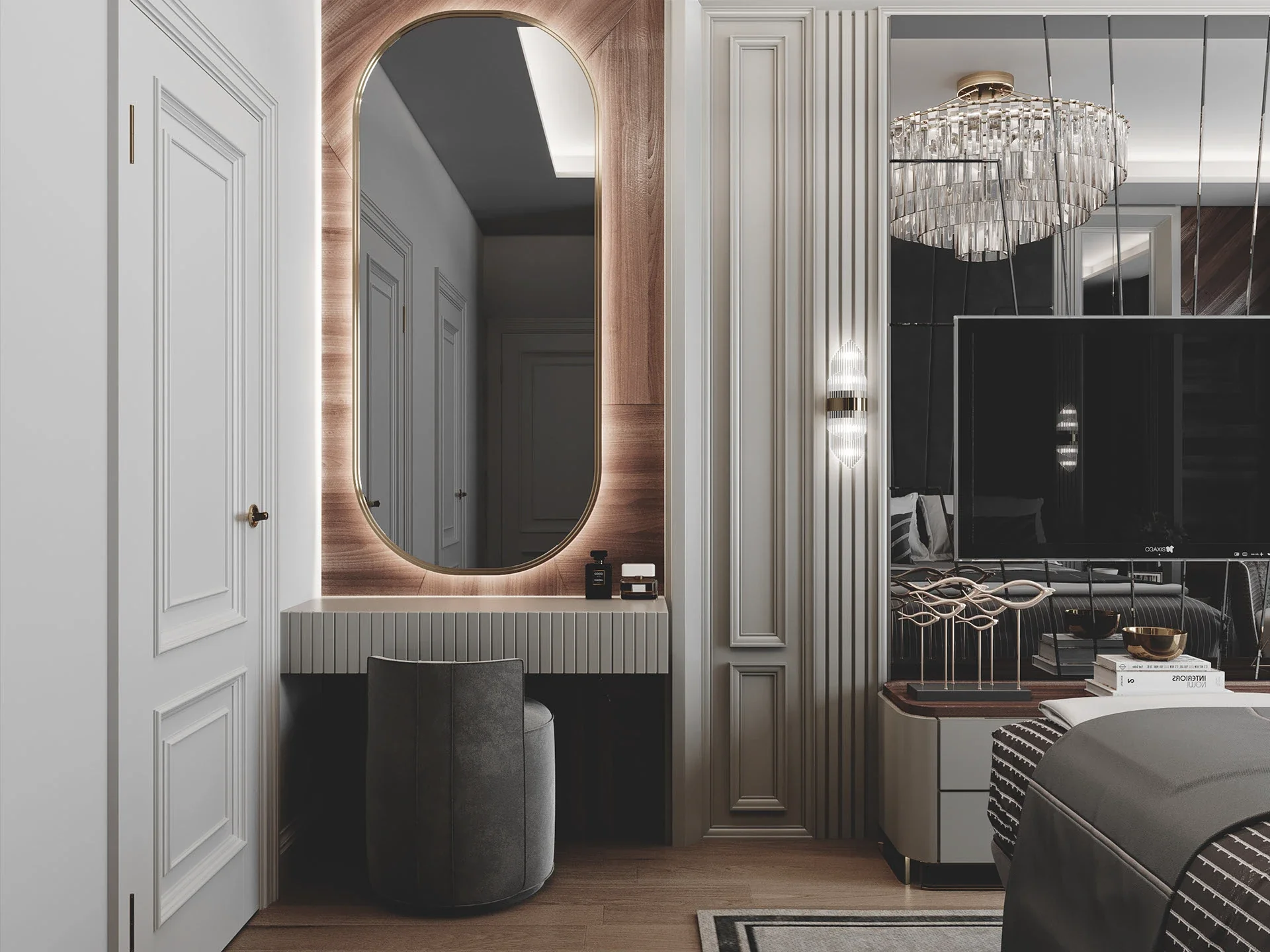 A chic vanity corner in a bedroom featuring a very tall pill-shaped mirror with gold trim, a floating fluted vanity drawer, a grey velvet stool, and glowing wall sconces.