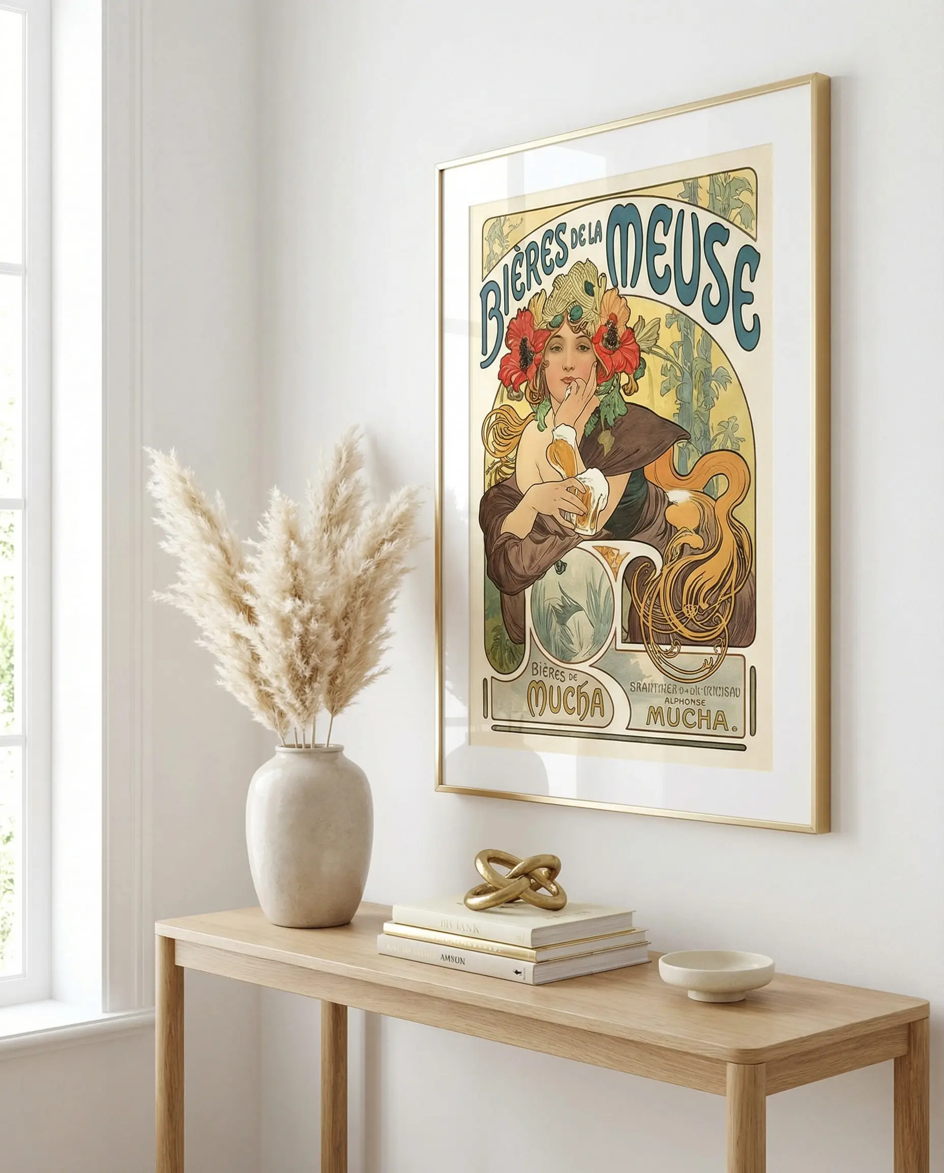 Large framed Alphonse Mucha poster hanging in a modern white hallway above a console table.