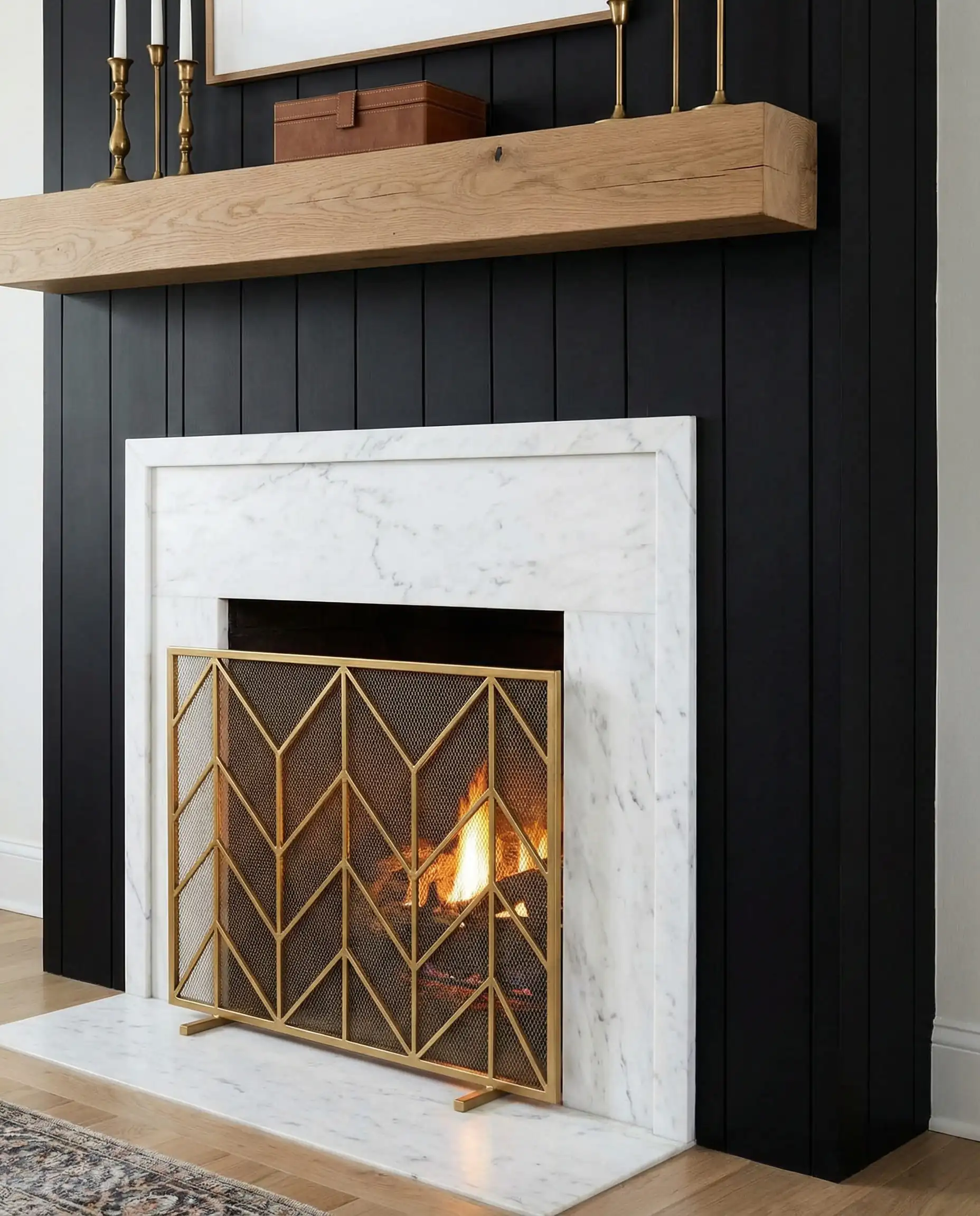 Fireplace featuring a white Carrara marble surround framed by vertical matte black shiplap.