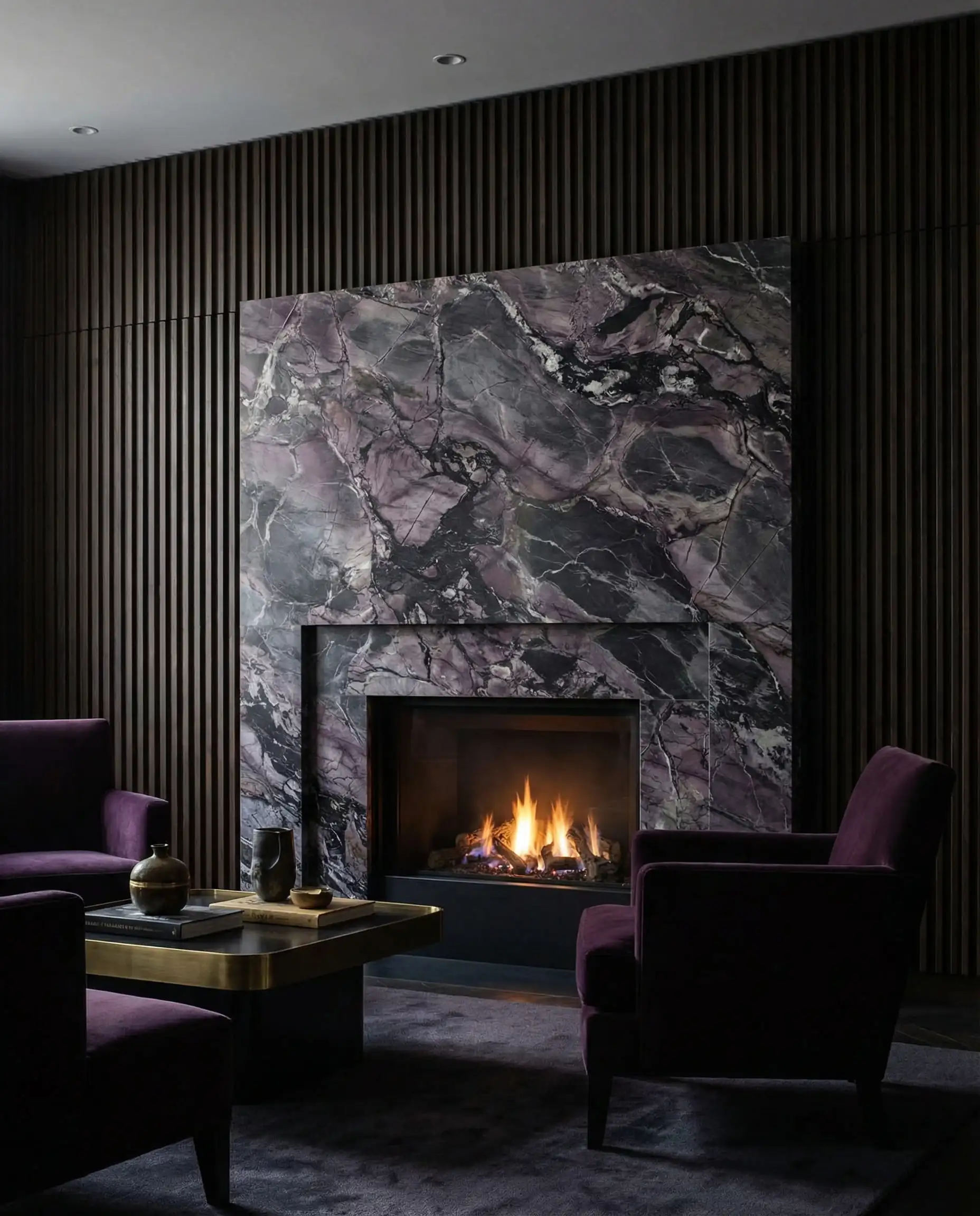 Dramatic Calacatta Viola marble fireplace surround with purple veining set against black slat wood.
