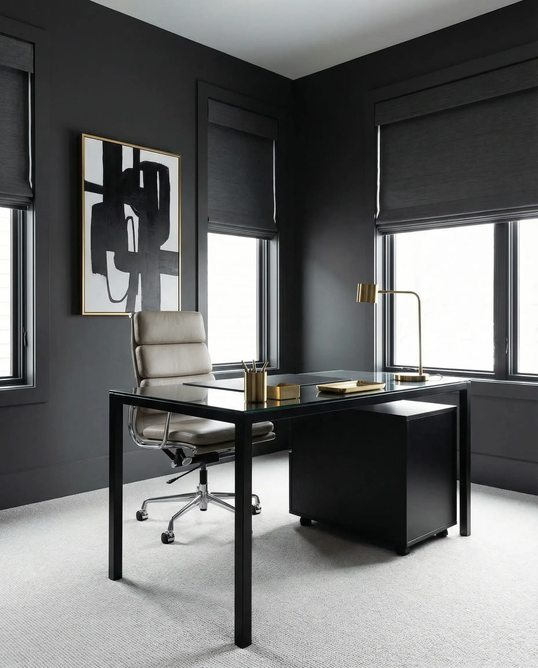 Modern home office with charcoal walls, a sleek black desk, and gold accessories.