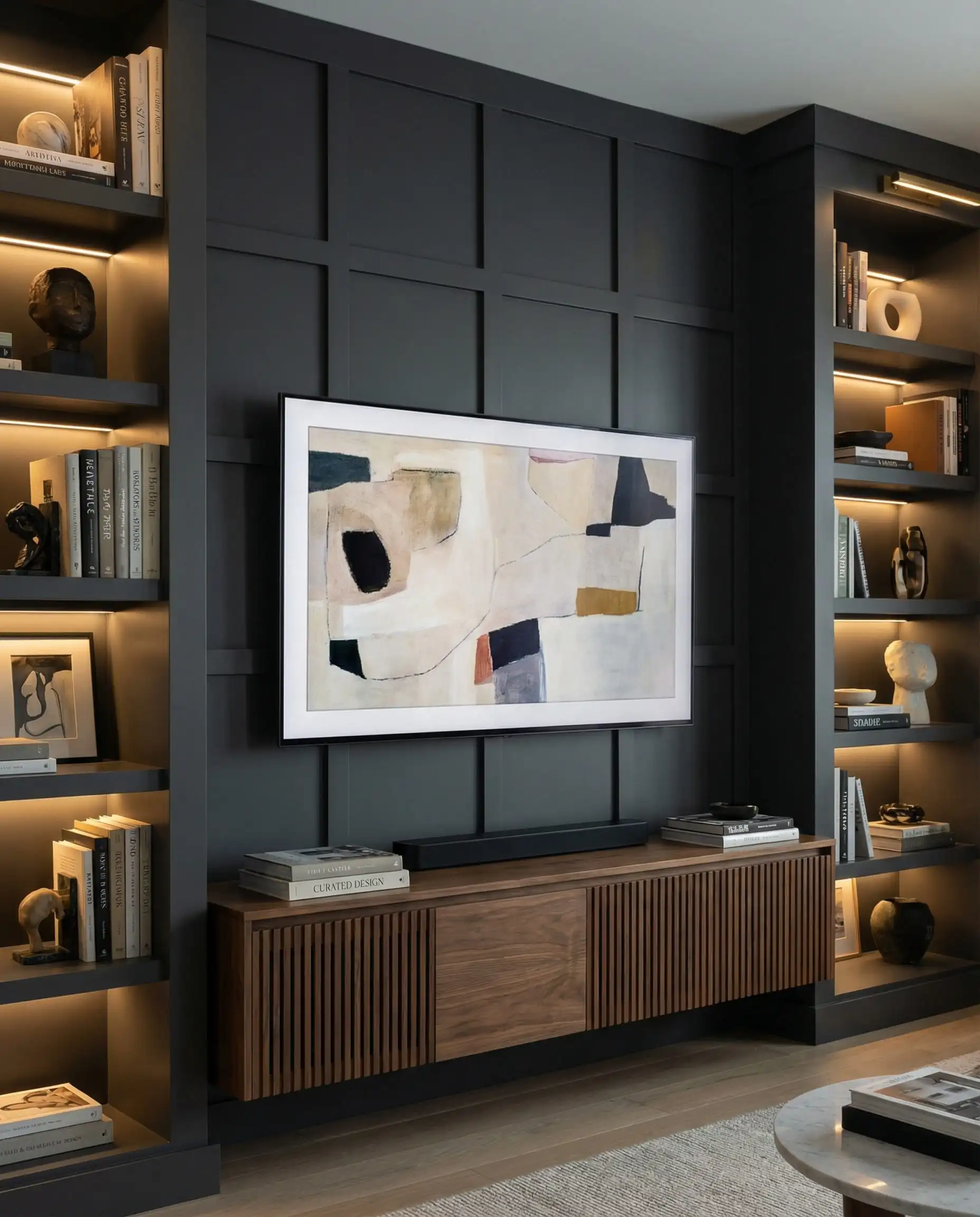 Contemporary living room with charcoal grey grid board and batten wall framing a mounted TV and floating console.