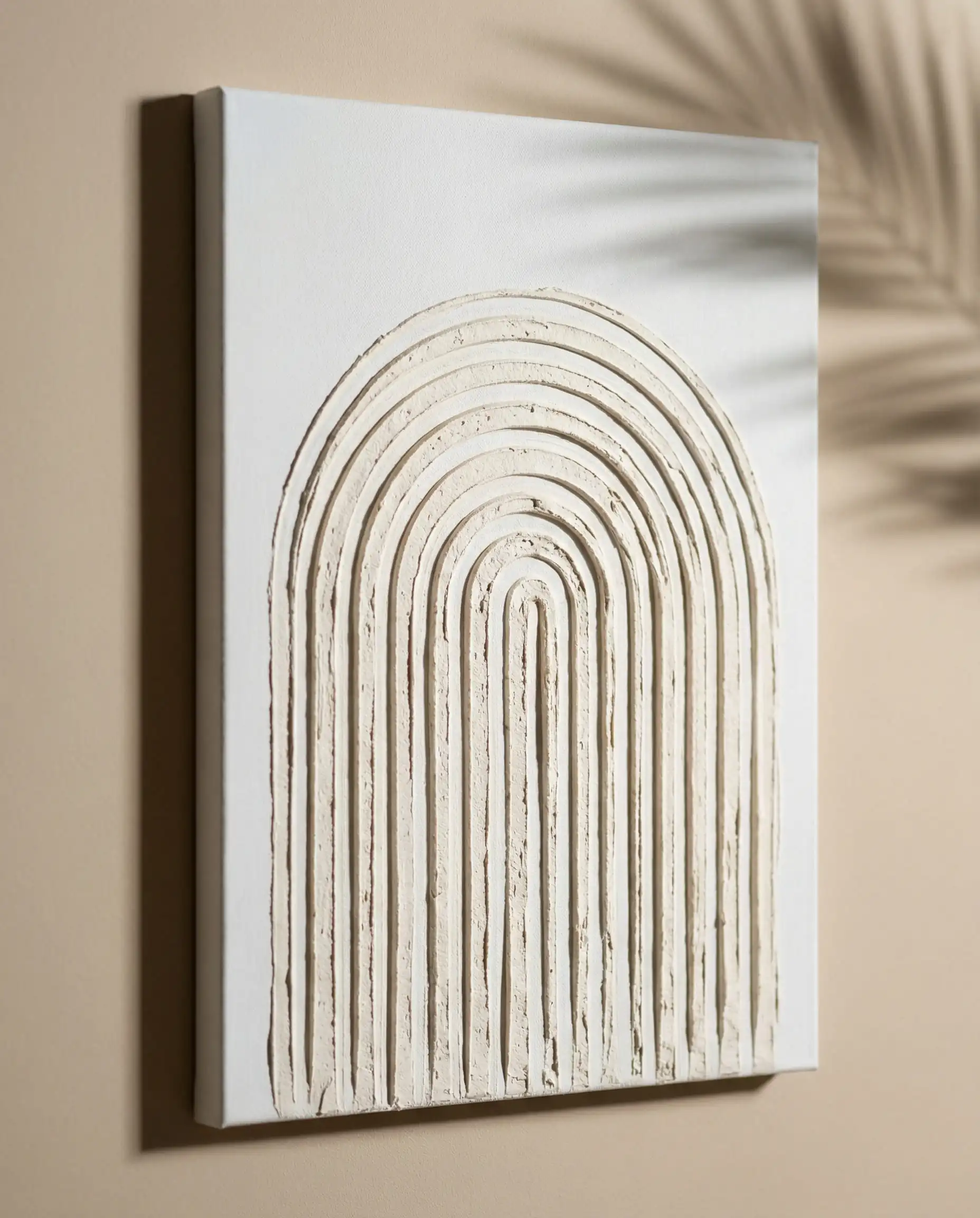 Close up of DIY textured canvas art made with joint compound featuring minimalist Japandi arch designs.