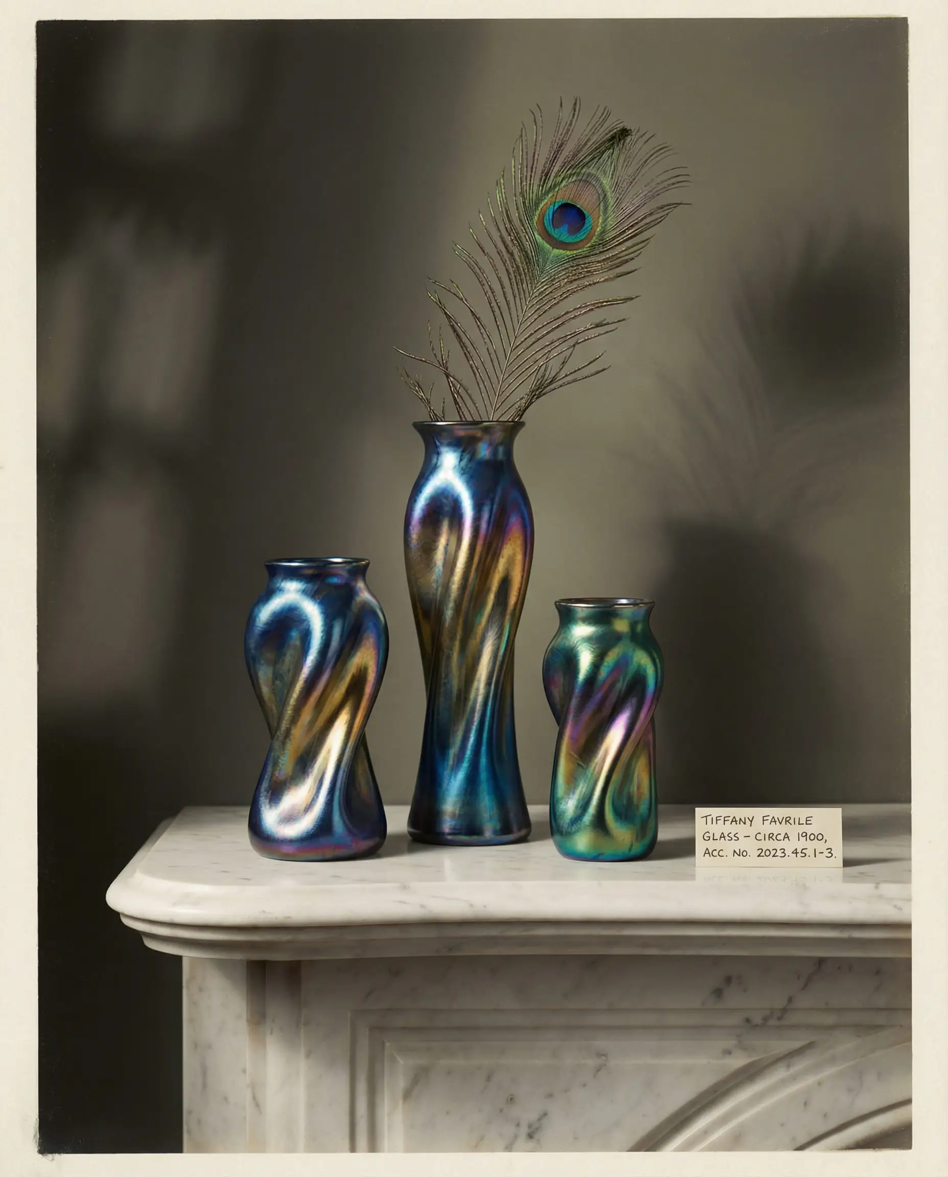 Trio of antique iridescent Tiffany-style Favrile glass vases arranged on a marble mantelpiece.