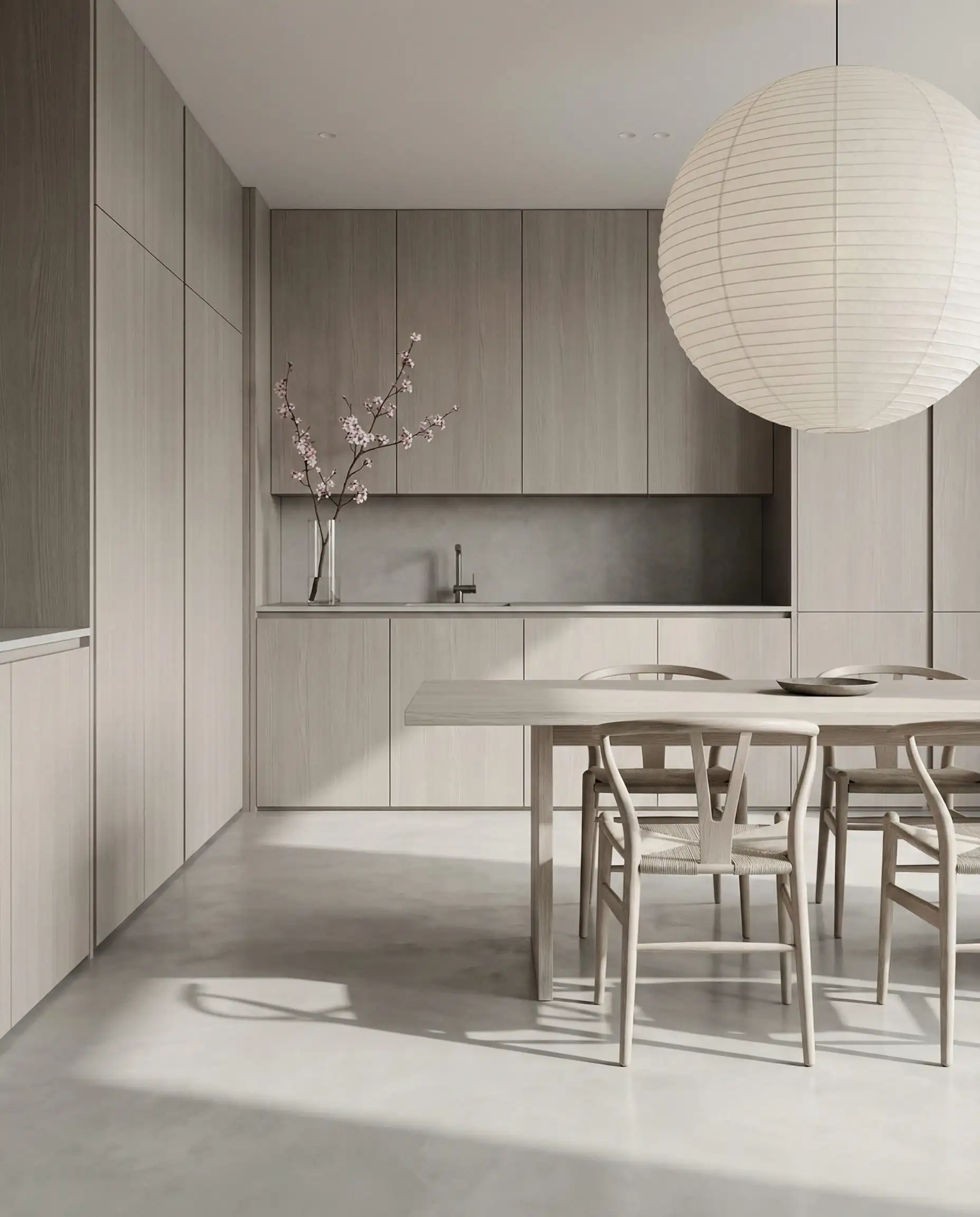 Minimalist kitchen with floor-to-ceiling taupe wood veneer cabinets on a seamless light gray micro-cement floor.