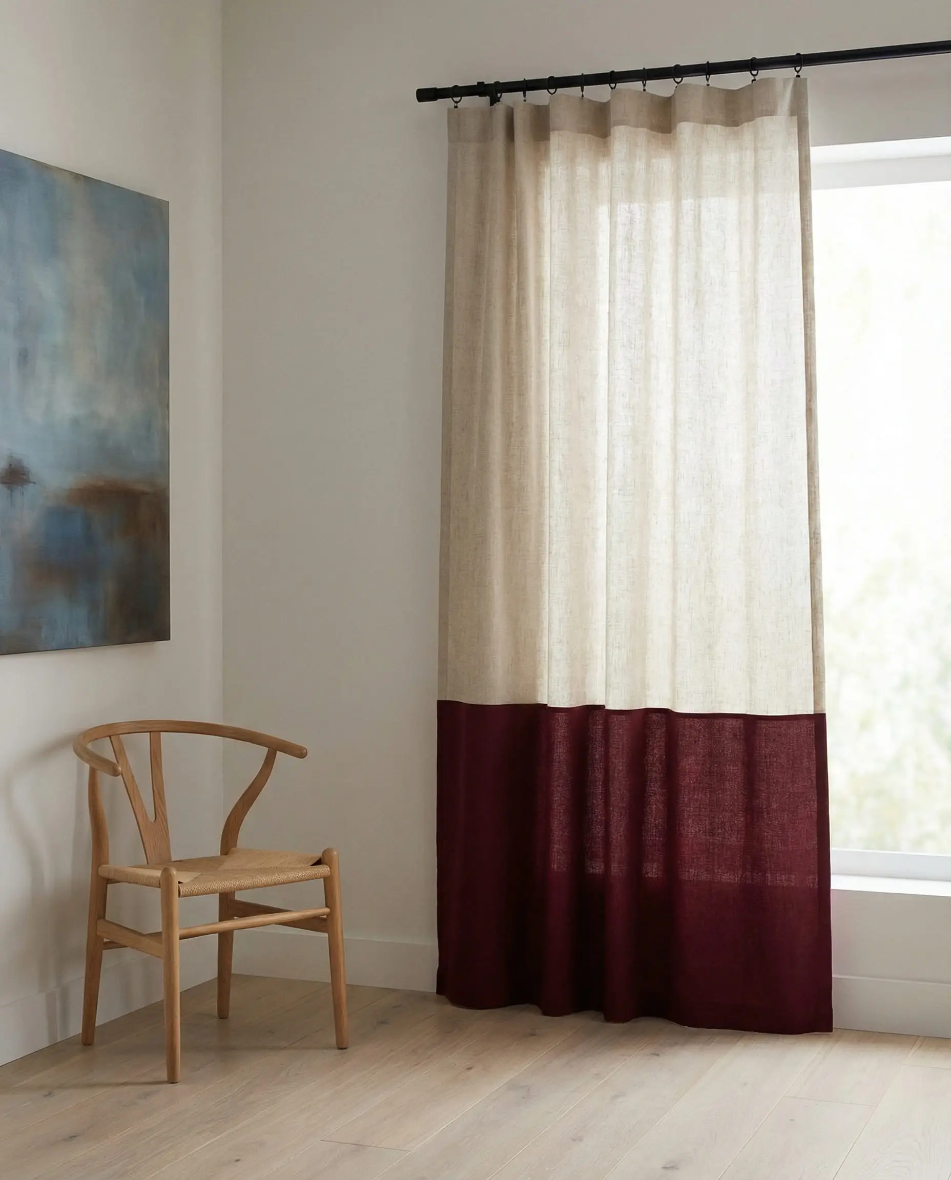 Modern color-block curtains with a solid burgundy bottom third and crisp white linen top section.