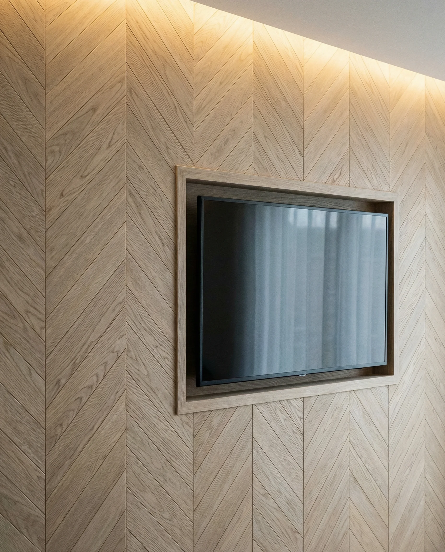 Bleached oak wood planks arranged in an intricate herringbone pattern on a feature wall behind a TV.