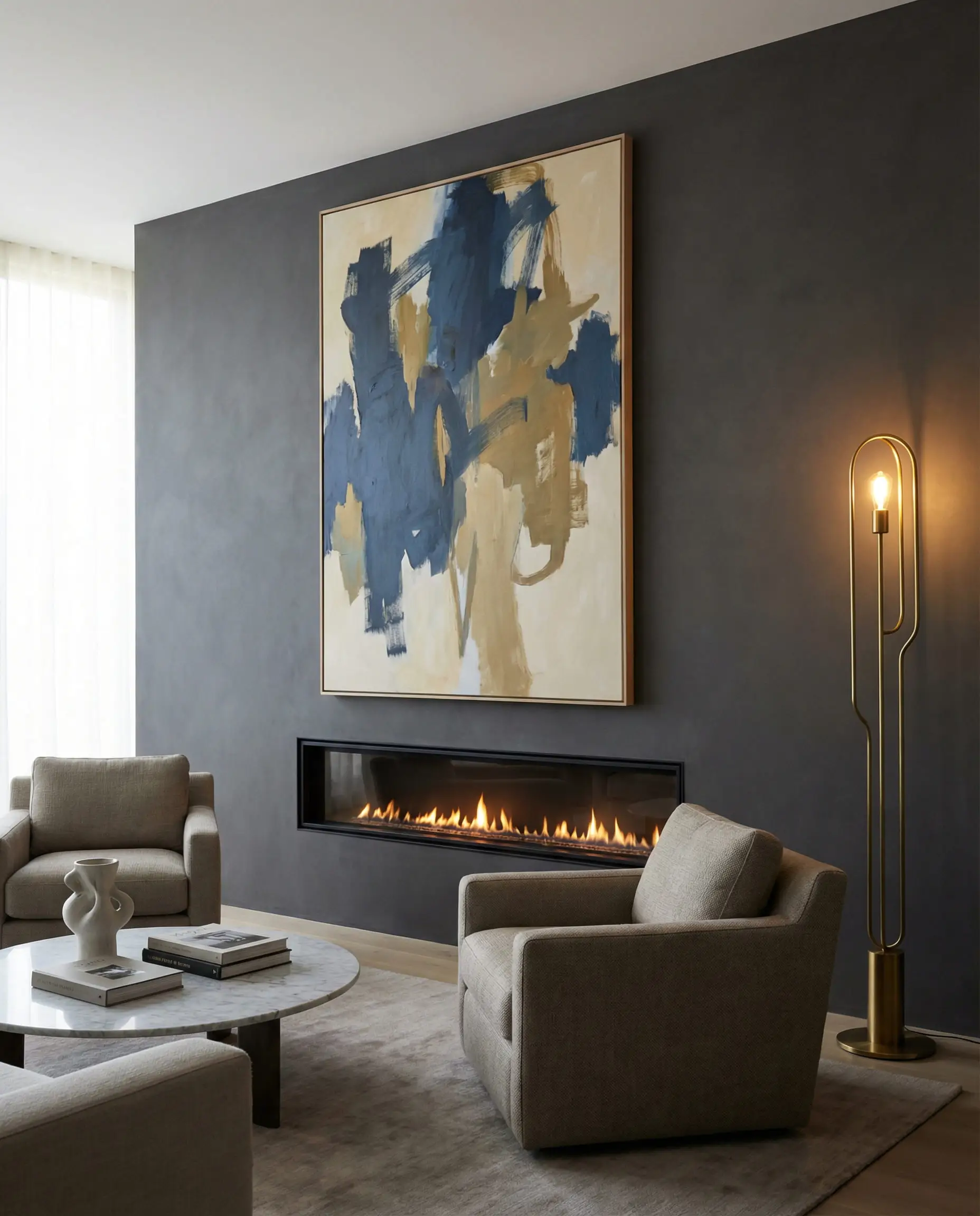 A sophisticated living room with a large abstract art canvas displayed above a linear fireplace instead of a TV.