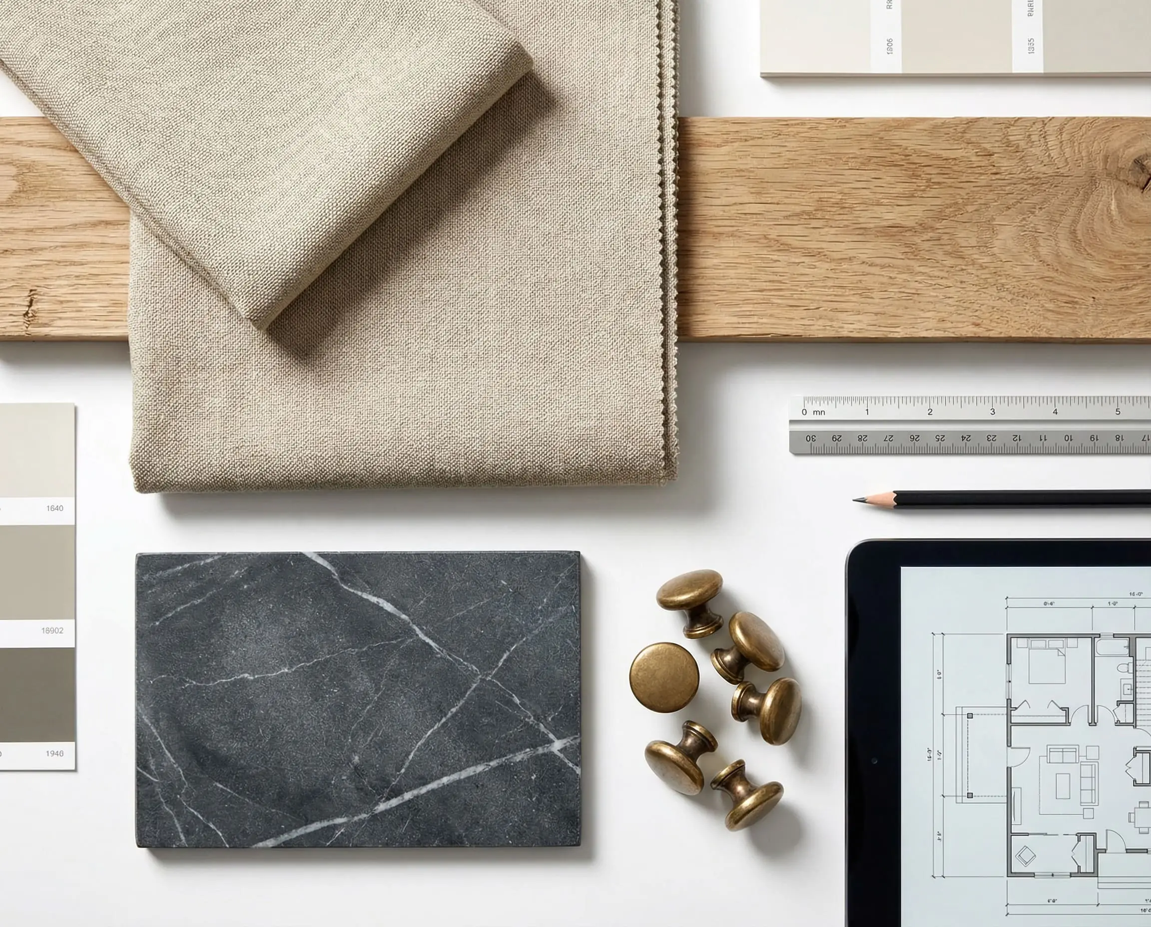 A flat-lay moodboard displays organic modern farmhouse textures including performance linen, reclaimed oak, and honed soapstone.