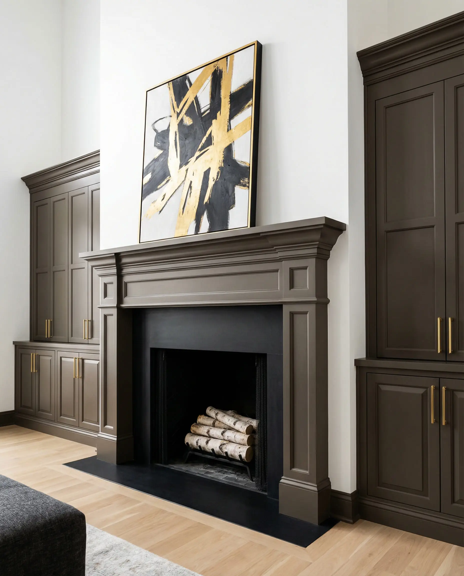 High-contrast living room with fireplace mantel and cabinetry painted in Sherwin-Williams Urbane Bronze.