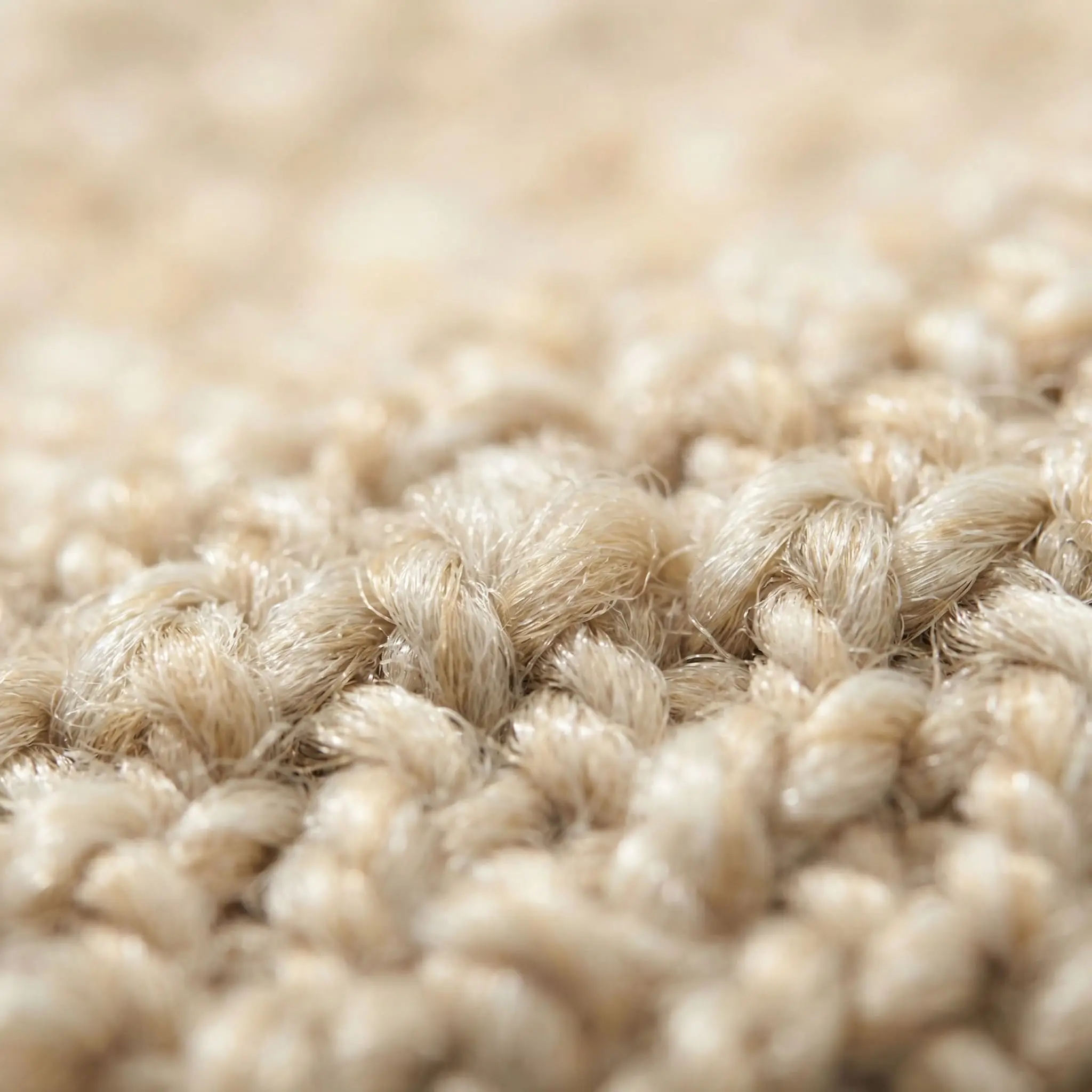 Macro shot of finely spun synthetic polypropylene fibers woven tightly to mimic an indoor flatweave that is scrubbable and indestructible.