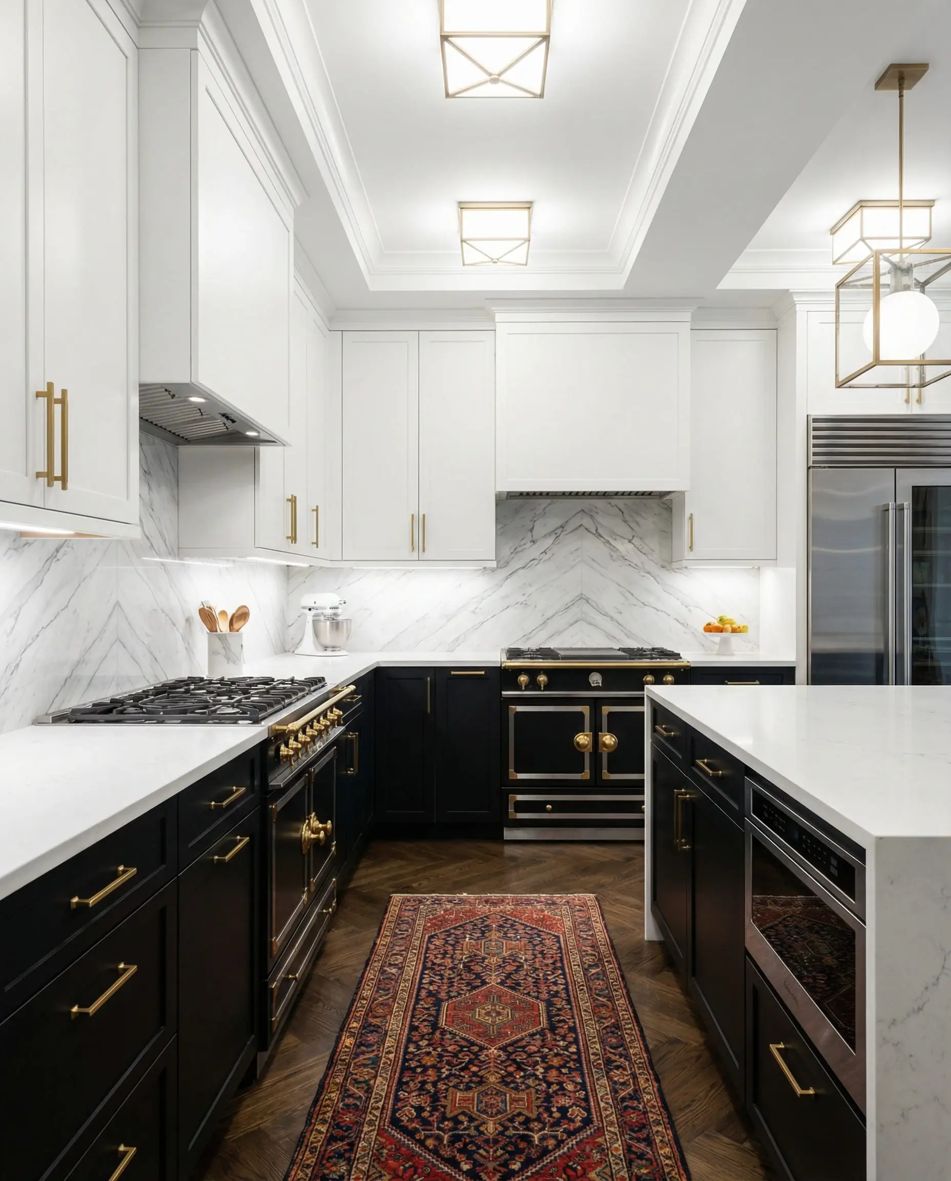Modern Art Deco kitchen with matte black lower cabinets, crisp white upper cabinets, and brushed gold handles.