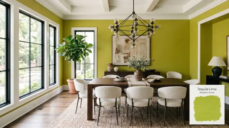 A high-end transitional dining room features dark walnut furniture and bouclé chairs against Benjamin Moore Tequila Lime (Hex #A6BA32) walls and crisp white trim.