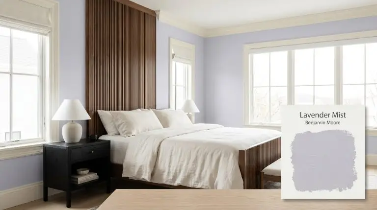A luxurious primary bedroom retreat painted in Benjamin Moore Lavender Mist (Hex #CFCFE0) features an ebonized ash nightstand and washed ivory linen sheets.