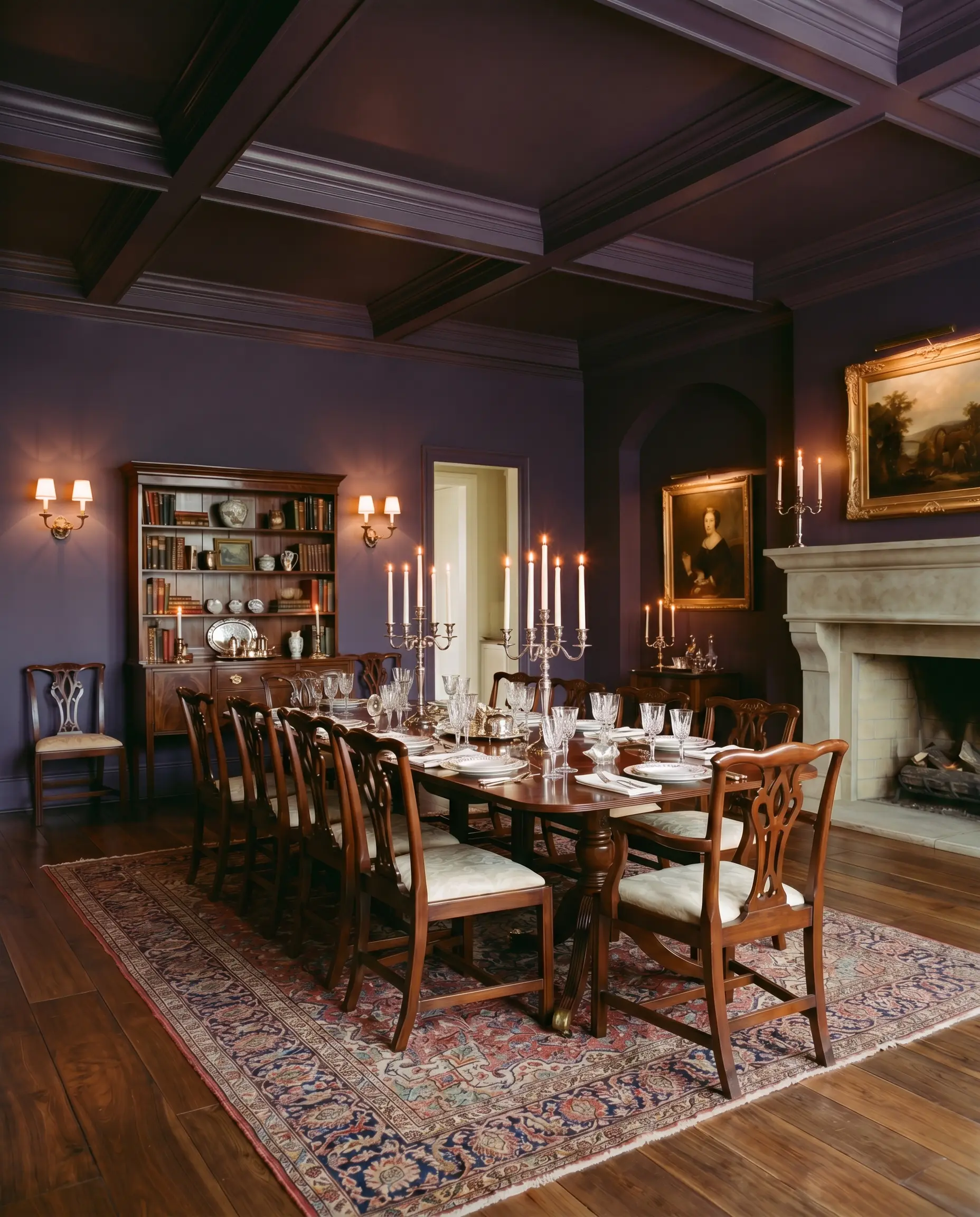 A traditional mahogany dining table and crystal glassware sit elegantly within a sophisticated formal dining room painted in Benjamin Moore Shadow.