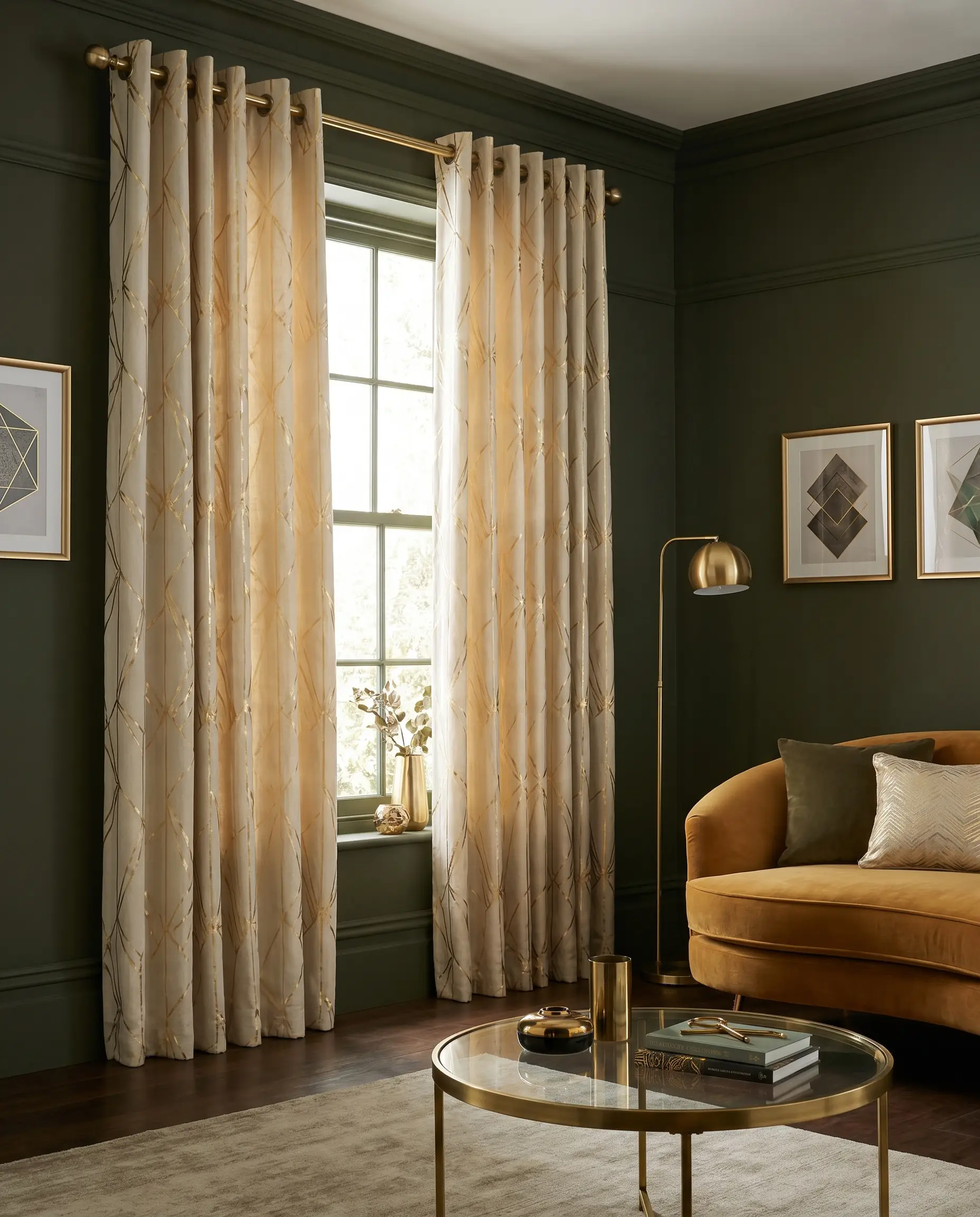 Cream-backed linen curtains featuring refined geometric gold foil lines hang behind a curved velvet sofa and glass-topped brass coffee table.