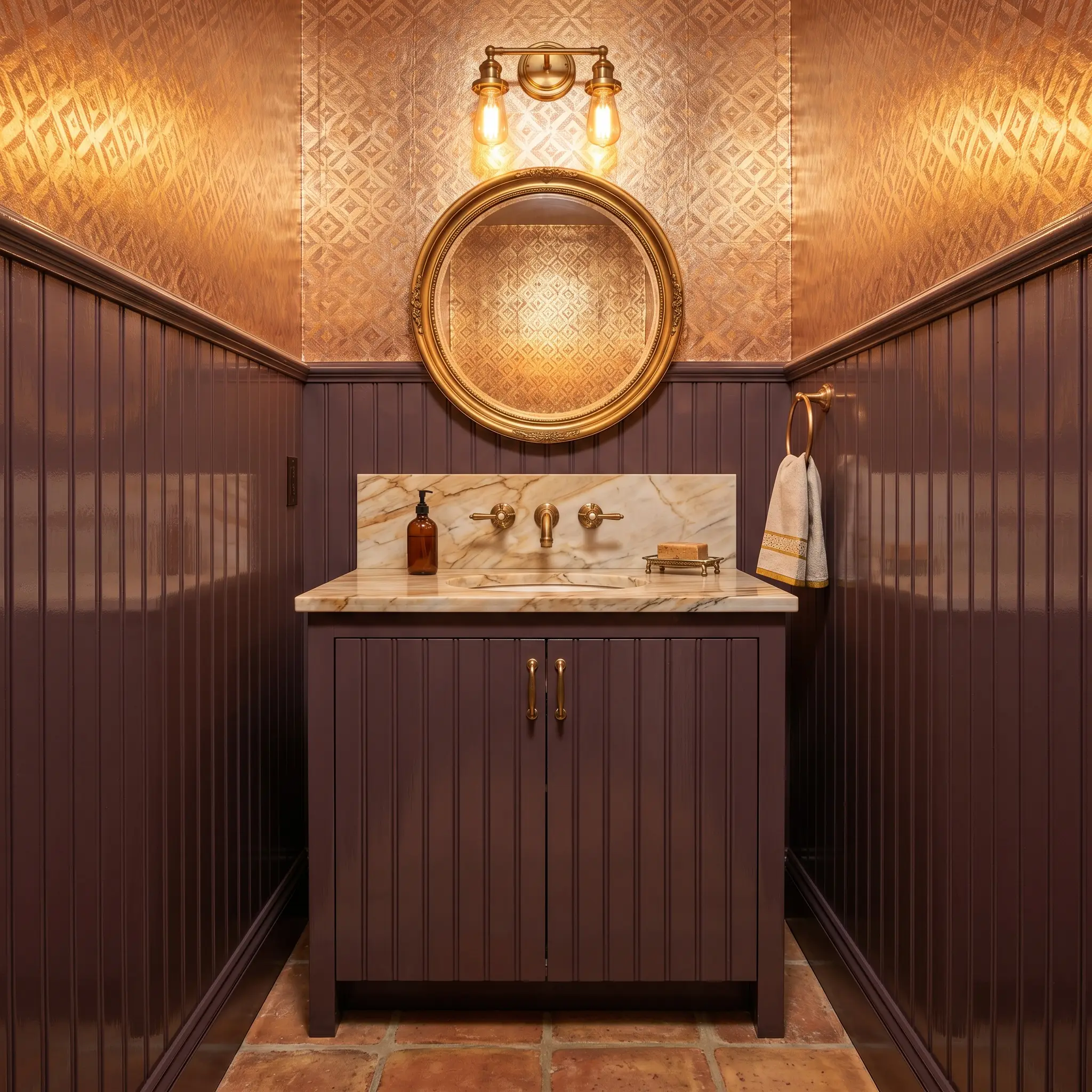 Unlacquered brass plumbing fixtures and a Calcutta Gold marble vanity glow against high-gloss plum cast beadboard paneling and reflective metallic foil wallpaper.