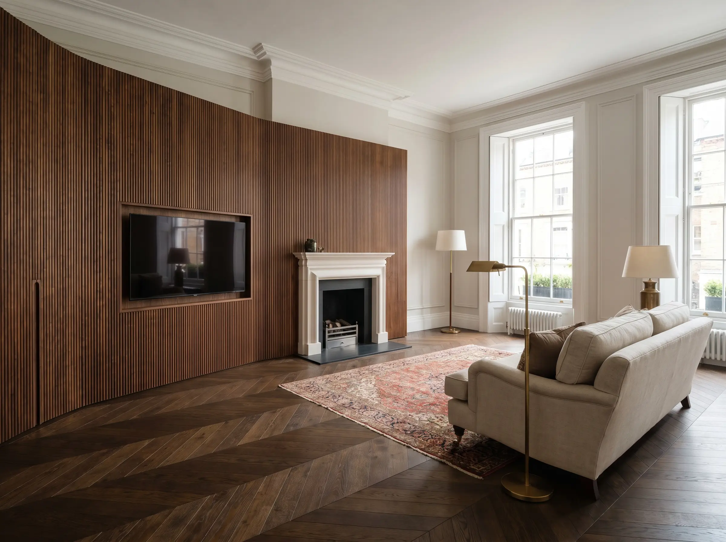The vertical lines of a walnut and dark wood slat media wall meet the geometric patterns of a dark oak chevron parquet floor.