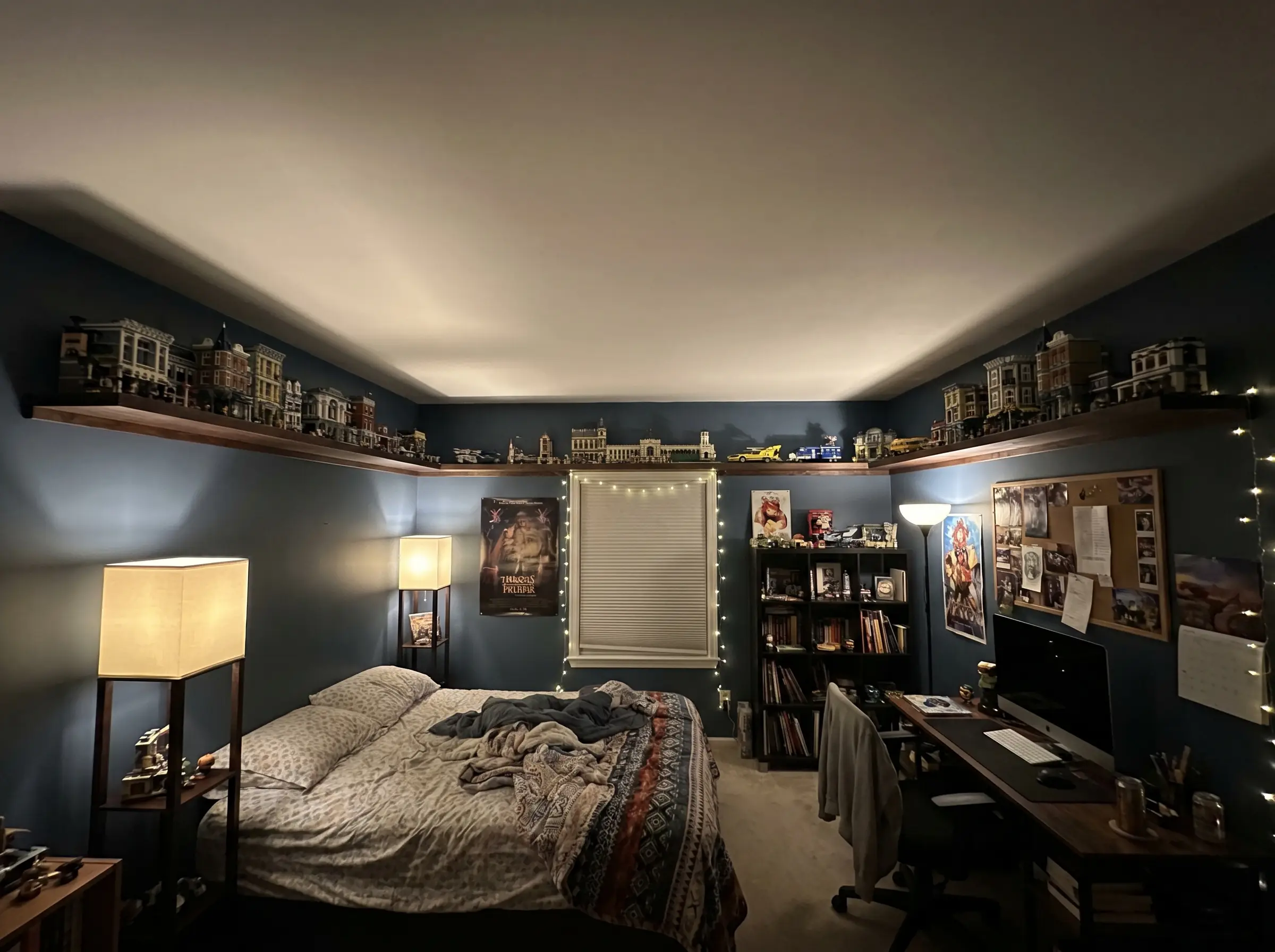 Continuous wooden floating ledges run twelve inches below the ceiling along the room's perimeter, displaying architectural Lego sets and figures.