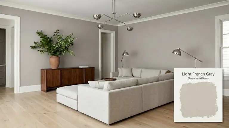 A sprawling modular sectional in light slub cotton anchors a living room painted in Sherwin-Williams Light French Gray (Hex #C2C0BB), featuring wide-plank white oak flooring.