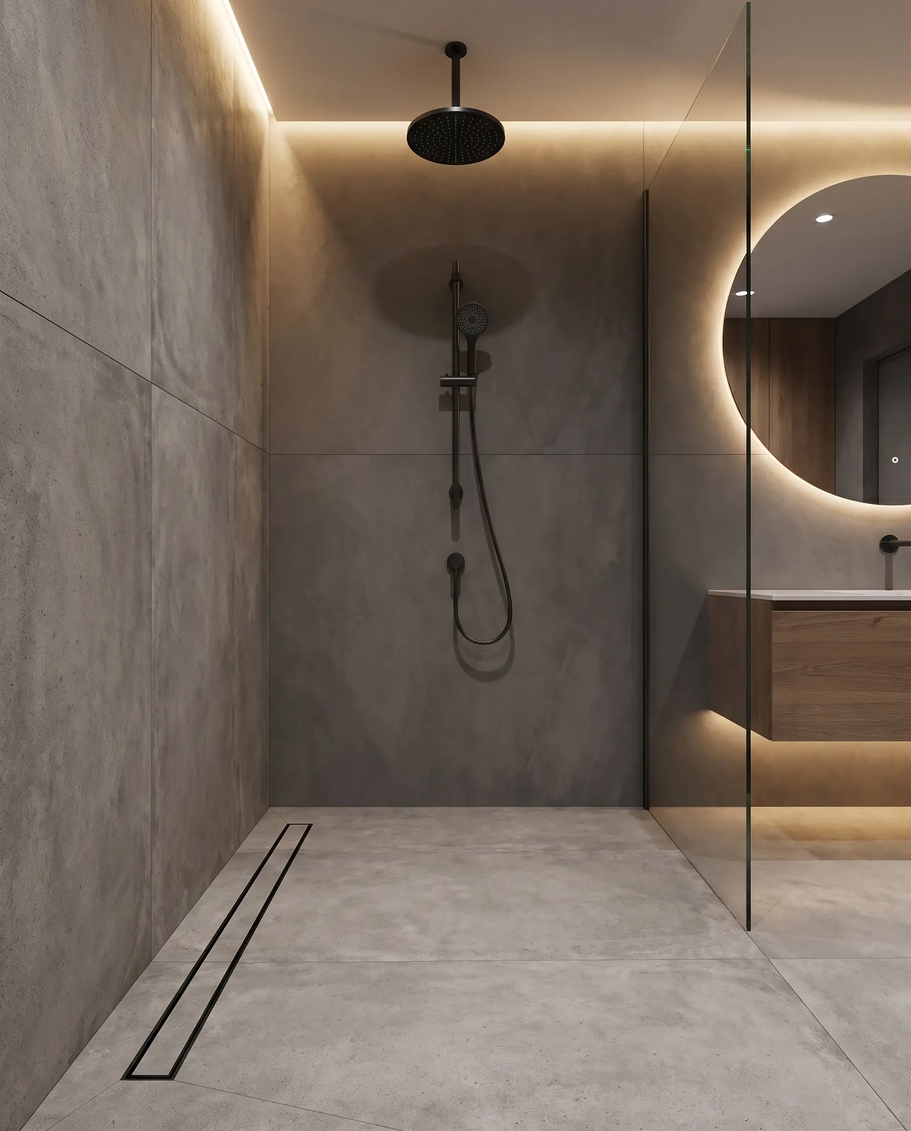 A small bathroom design utilizing a curbless wet room configuration with large-format concrete-look tiles, a frameless glass partition, and matte black shower fixtures.