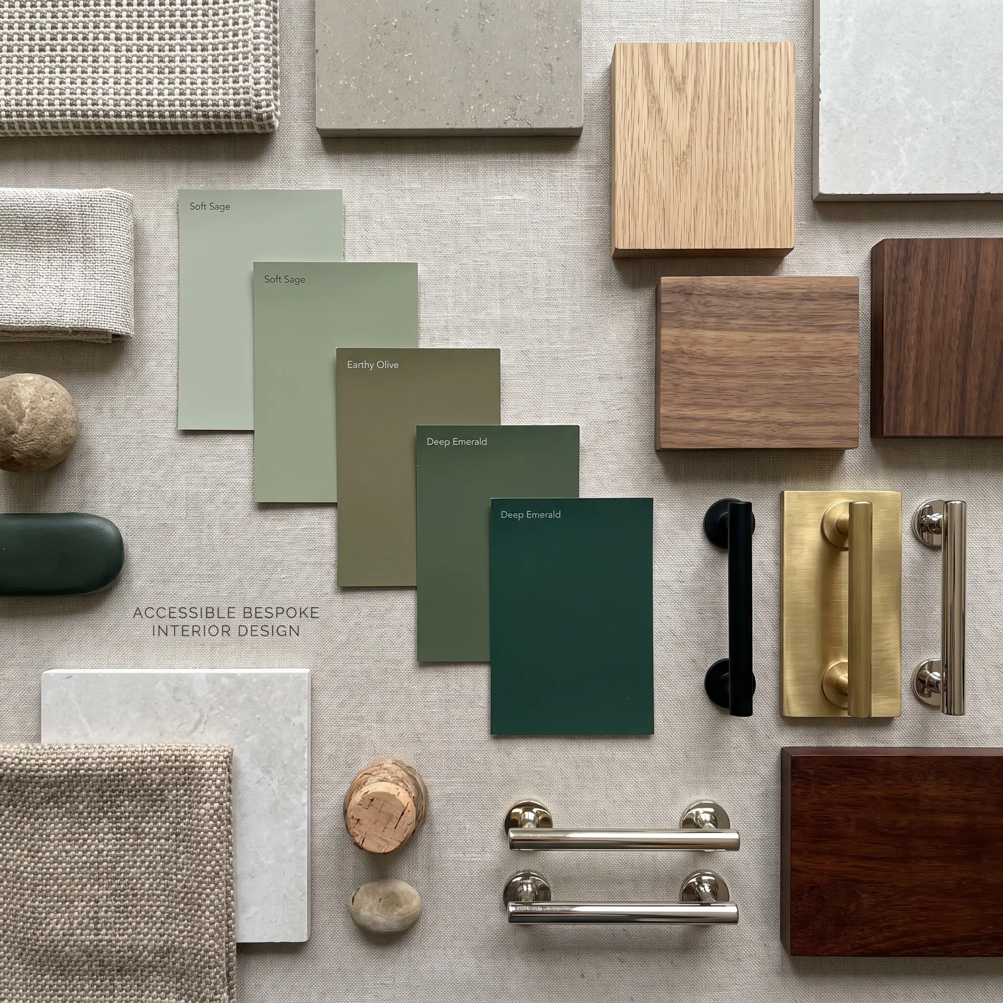 A material moodboard flatlay displays sage, olive, and emerald paint swatches alongside rift-sawn white oak, dark mahogany, and unlacquered brass hardware samples.