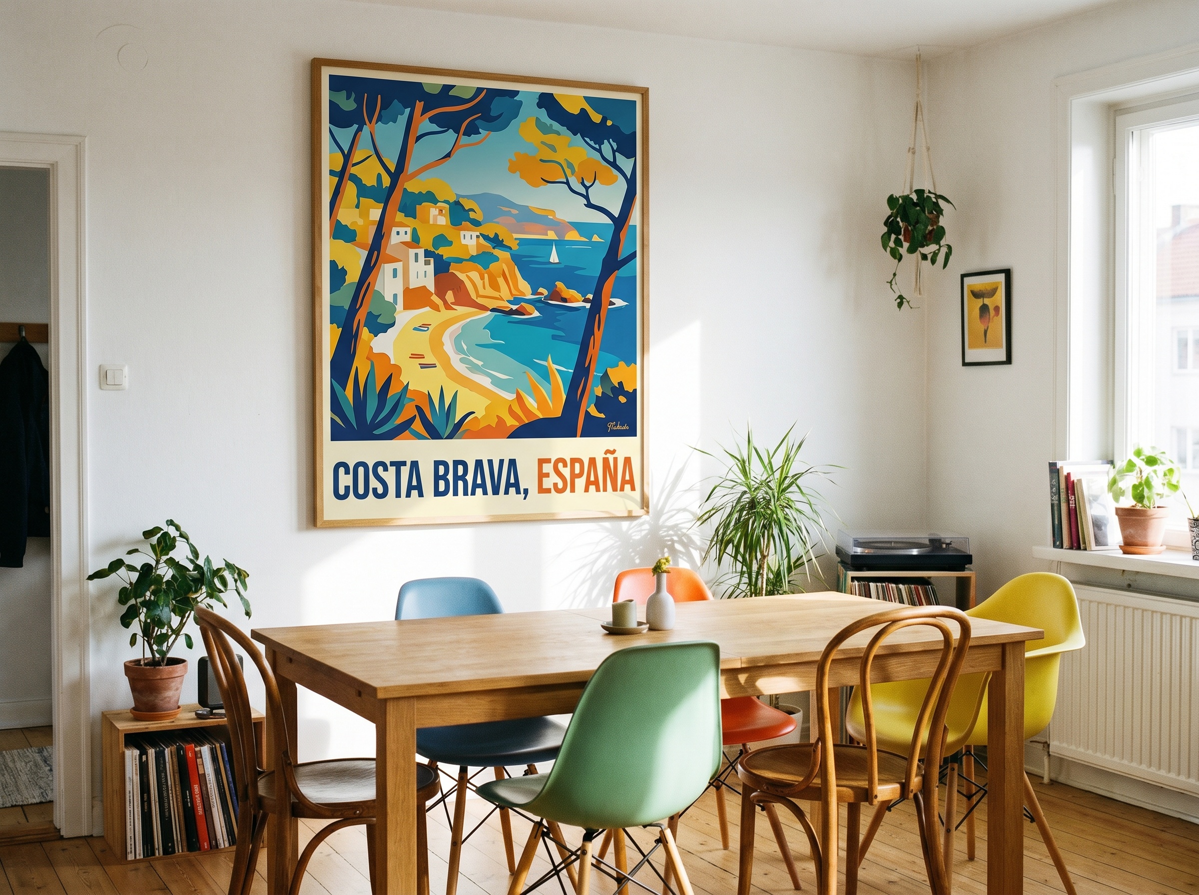 A saturated 1950s Mid-Century vintage European travel poster anchors a bright dining room featuring a standard wooden table and colorful modern chairs.