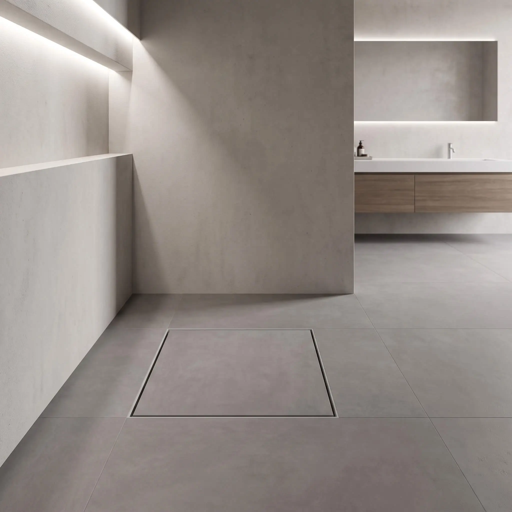A perfectly cut square of matte gray porcelain floor tile sits directly over a grate to camouflage an invisible tile-insert center drain near a sleek freestanding vanity.