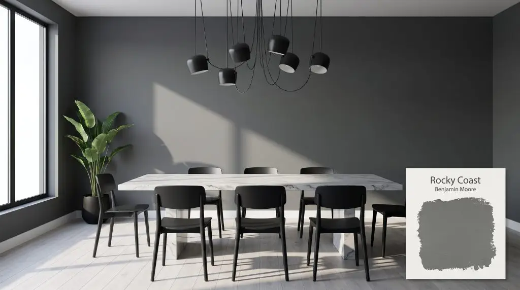 A sleek marble table and matte black fixtures sit before a dramatic modern dining room wall coated in Rocky Coast (Hex #6C7171).