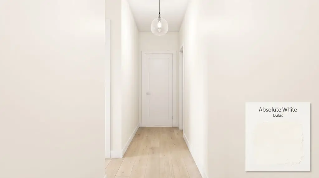 A narrow hallway feels expansive with light engineered oak flooring, minimalist trim, and warm walls finished in Dulux Absolute White (Hex #F7F5EE).