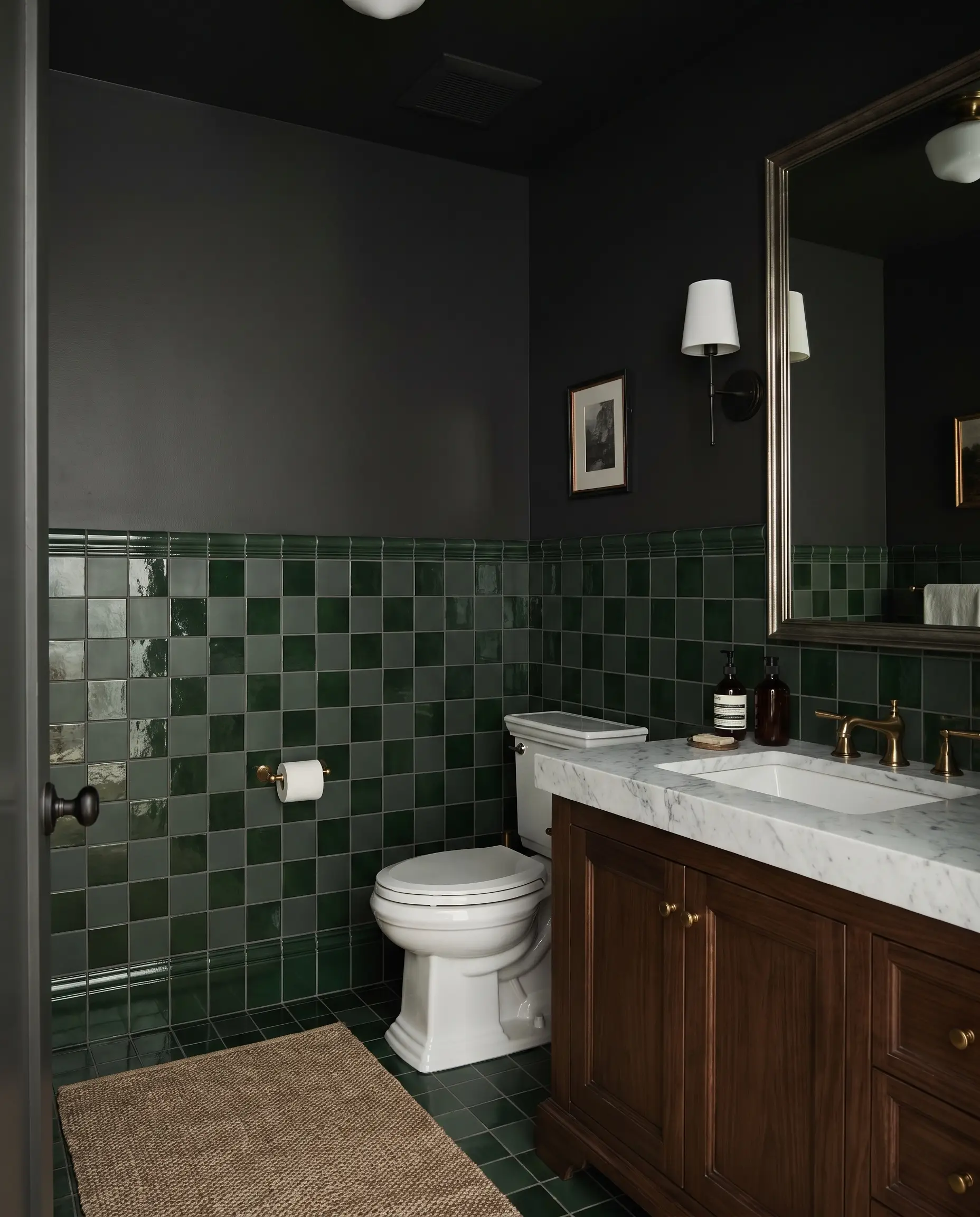 Deep green matte and glossy square ceramic tiles form checkerboard wainscoting, showcasing bathroom wall covering trends 2027 below Sherwin-Williams Greenblack painted walls.